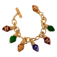 Vintage Chanel Charm Bracelet Golden Metal with Glass Paste Charms, 1995