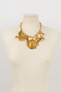 Chanel Charm Necklace in Gold Metal