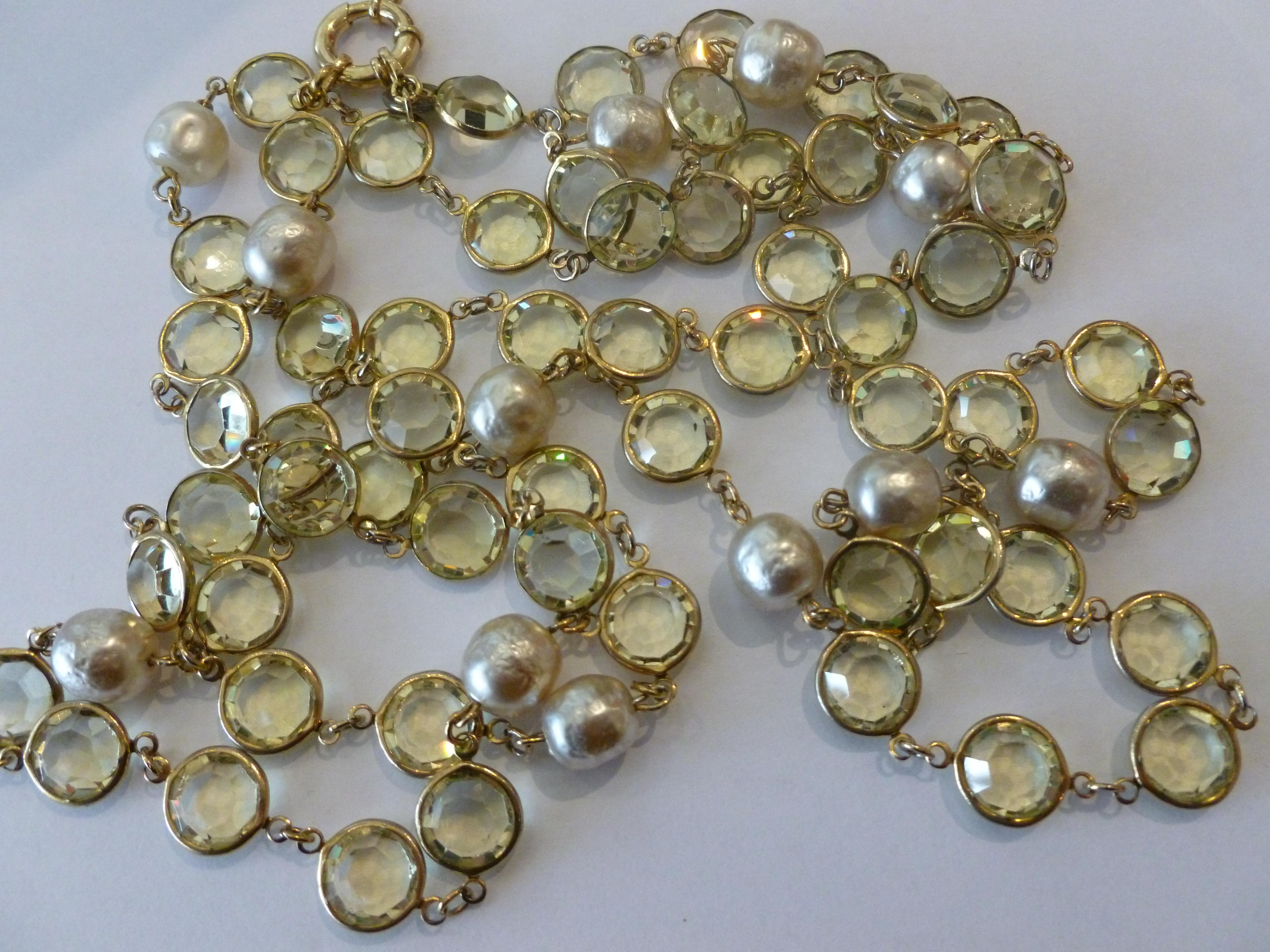 This stunning, bright and happy vintage Chanel sautoir long necklace is a gorgeous color of chartreuse beveled crystals with faux pearl interspersed. It can be wrapped twice or three times around your neck. The color is a light chartreuse green that