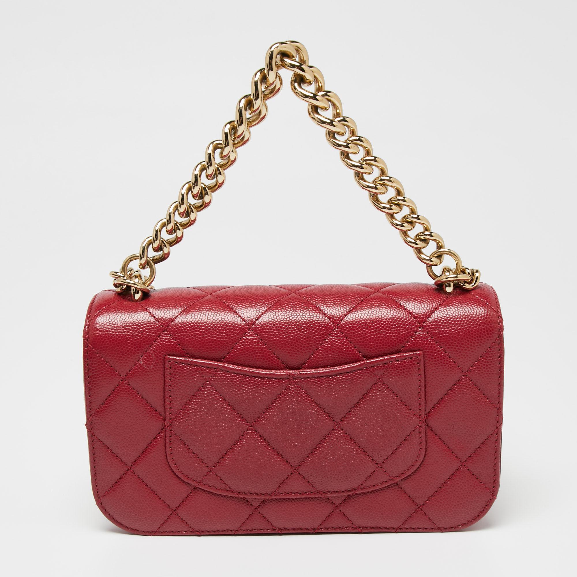 The gold-tone metal studs, the CC lock on the flap, and the diamond quilt combine to make this Chanel flap bag a special one. It is sewn using cherry red Caviar leather and held by two different handles.

Includes: Original Dustbag, Original Box,