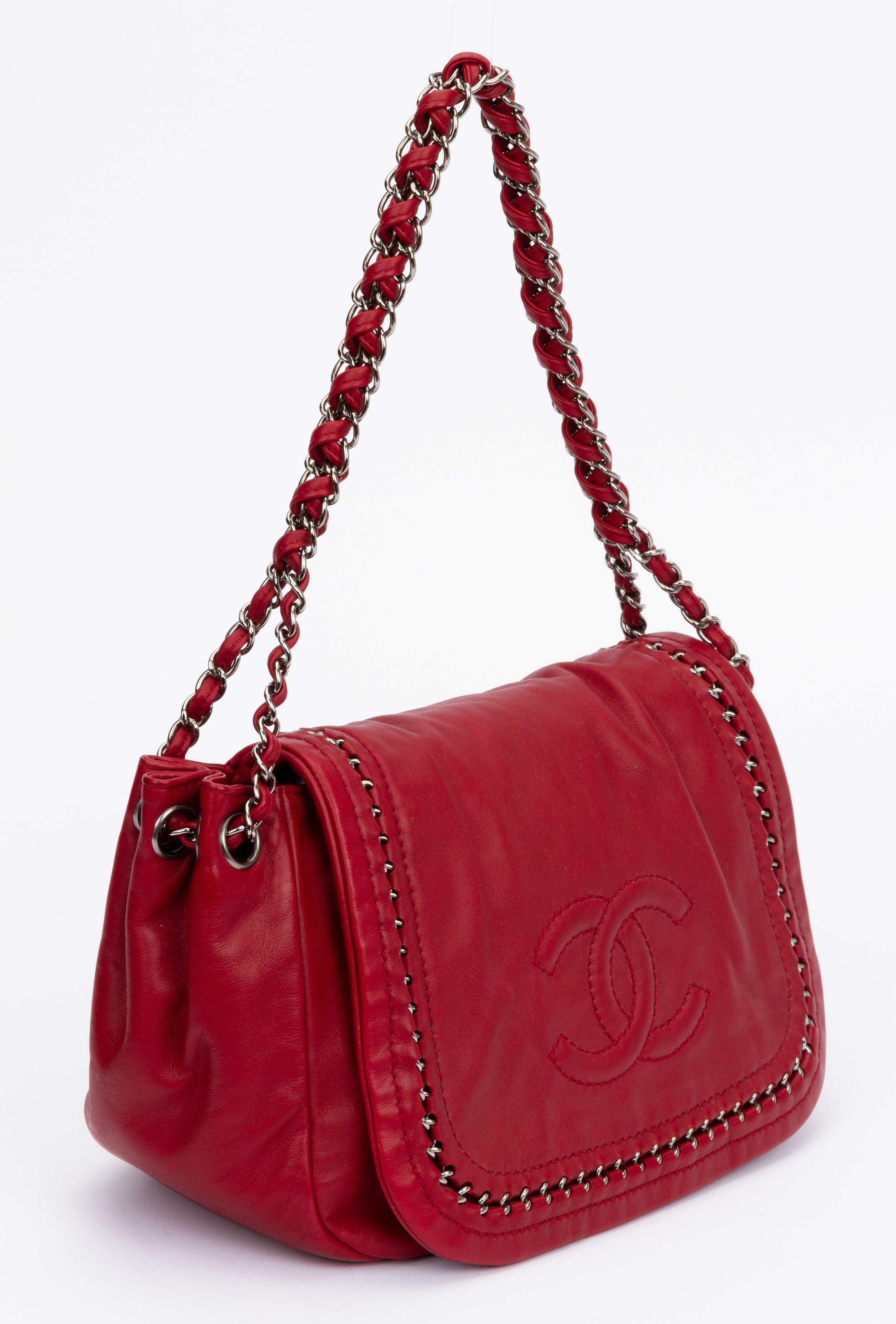 Chanel cherry red leather shoulder bag with chain inlay decoration. Very good condition, pen marks inside photographed in the last phot. Outer leather in excellent condition. Shoulder drop 9.5