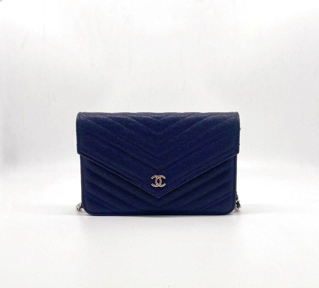 Chanel Chevron Wallet on Chain Navy Caviar Leather with Silver Hardware
 These are professional photos of the actual bag offered by Luxbags.
 
 This timeless Chanel WOC Wallet on Chain is crafted from exquisite navy caviar leather with a classic