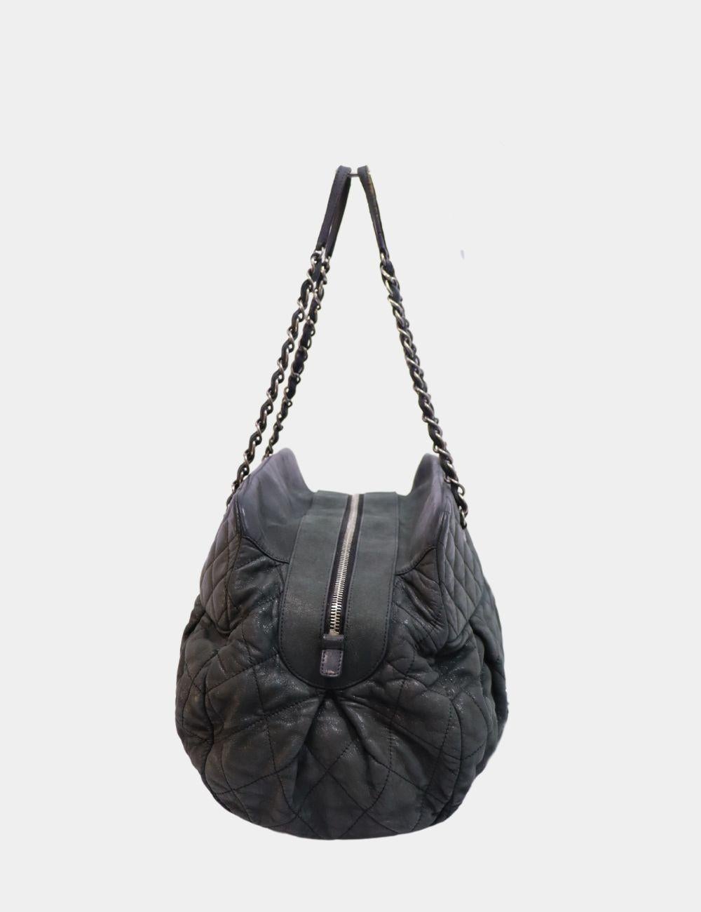 Elevate your everyday style with this luxurious Chanel Black Quilted Leather Tote. Crafted from supple black leather with Chanel’s iconic diamond quilting, this spacious tote features silver-tone chain and leather shoulder straps and a prominent CC
