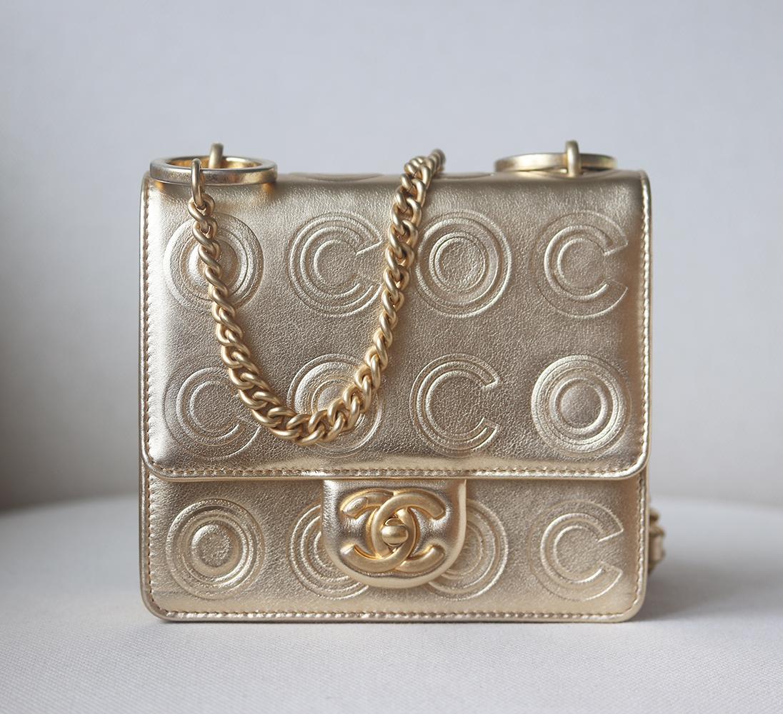 Chanel Circle C Calfskin Square Flap Bag has been hand-finished by skilled artisans in the label's workshop.
Boasting a metallic embossed calfskin exterior, this structured design is accented with intentionally distressed gold-toned chain and