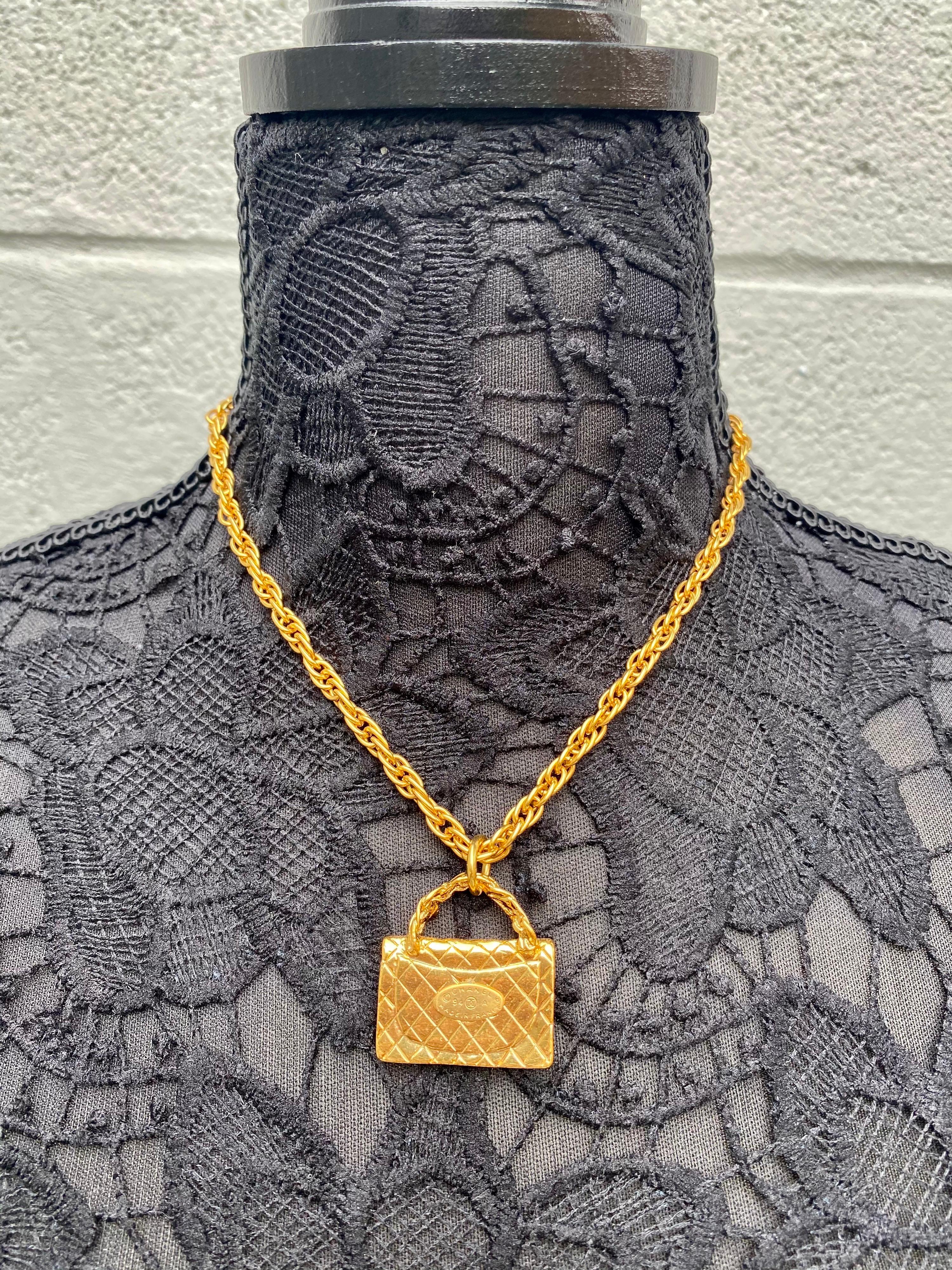 The timeless Chanel Flap Bag charm necklace makes this a fabulous fashion accessory.  This is a Chanel gold classic flap handbag with all of the detailing including diamond quilting and a Chanel CC turn lock. Wear this fabulous necklace for a