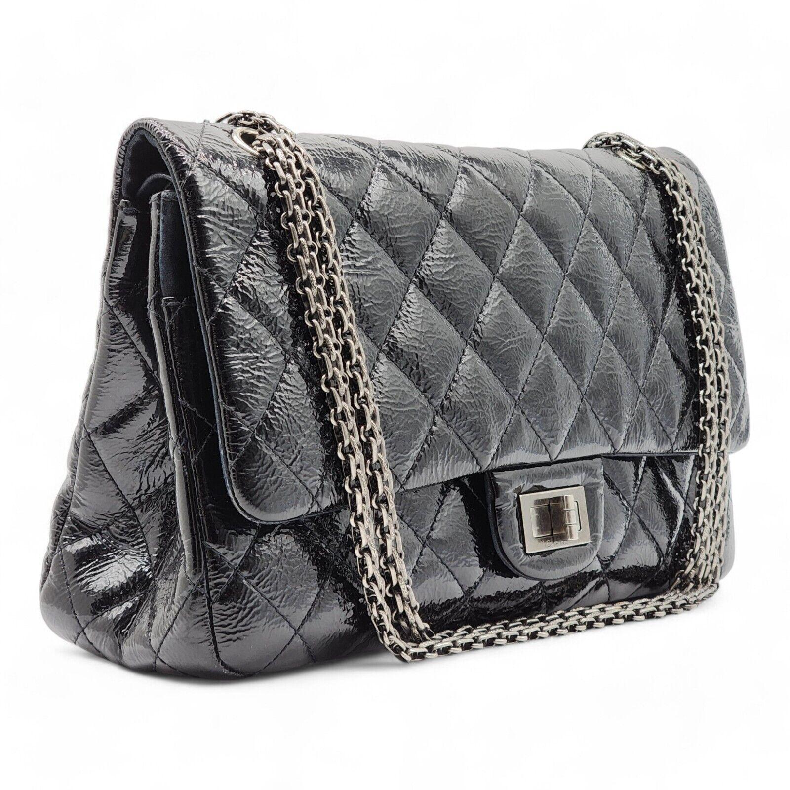 Chanel Classic 2.55 Reissue Jumbo Double Flap Bag - Quilted Patent Leather Black.

Additional information:
Material: Patent Leather
Series: 14
Color: Black
Country: Italy
Dimension: Jumbo size; 12