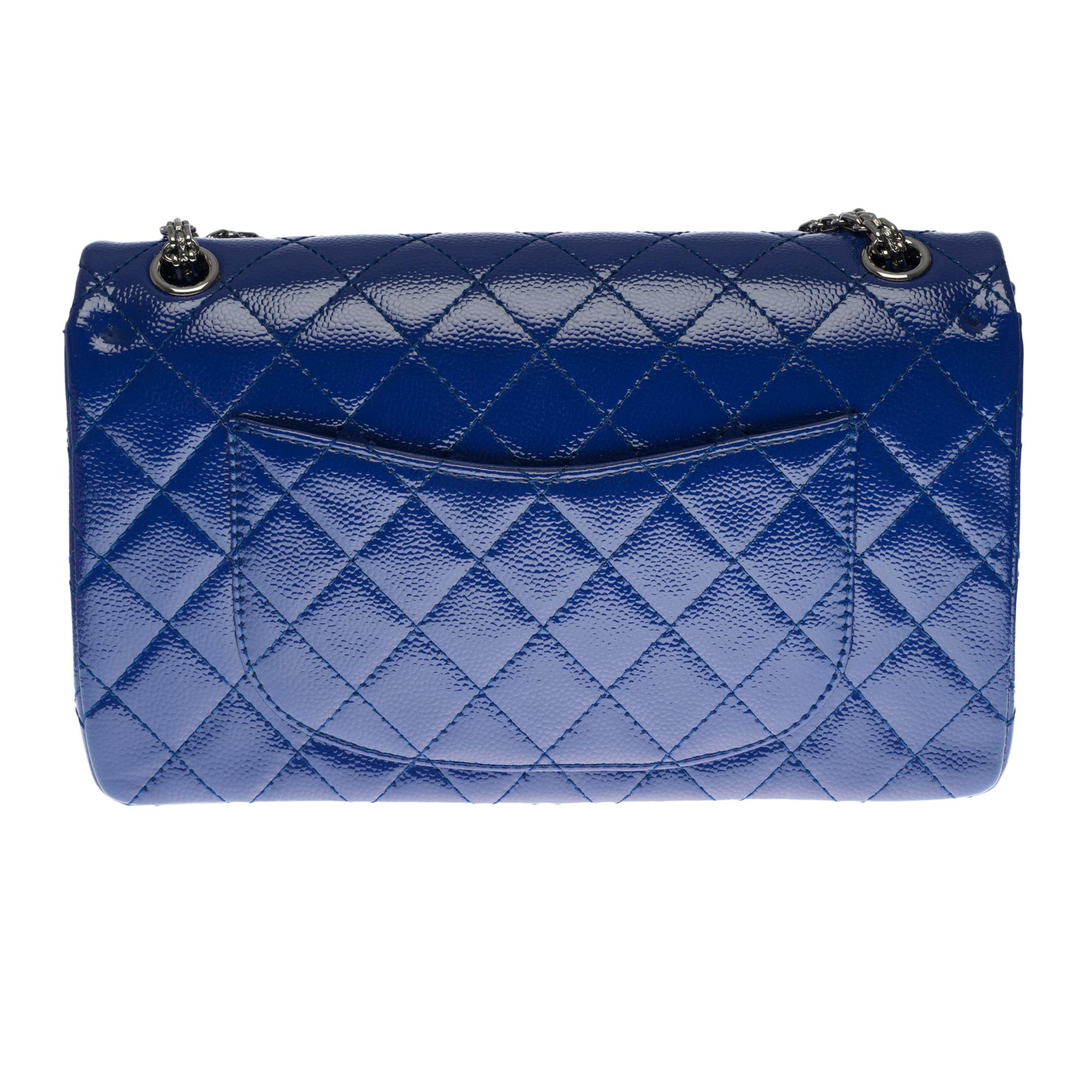 Stunning Chanel 2.55 Classic handbag in electric blue quilted patent leather (with violet reflection), black silver metal hardware, a Mademoiselle chain handle transformable into silver metal allowing a hand or shoulder or shoulder