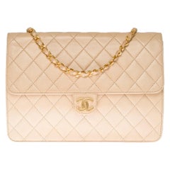 Chanel Classic 25cm shoulder bag in beige quilted lambskin and gold hardware