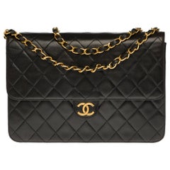 Chanel Classic 25cm shoulder bag in black quilted lambskin and gold hardware