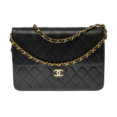 Chanel Classic 25cm shoulder bag in black quilted lambskin and gold hardware