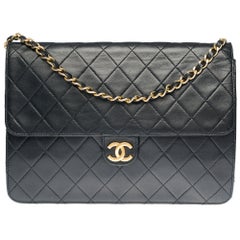 Chanel Classic 25cm shoulder bag in black quilted lambskin and gold hardware