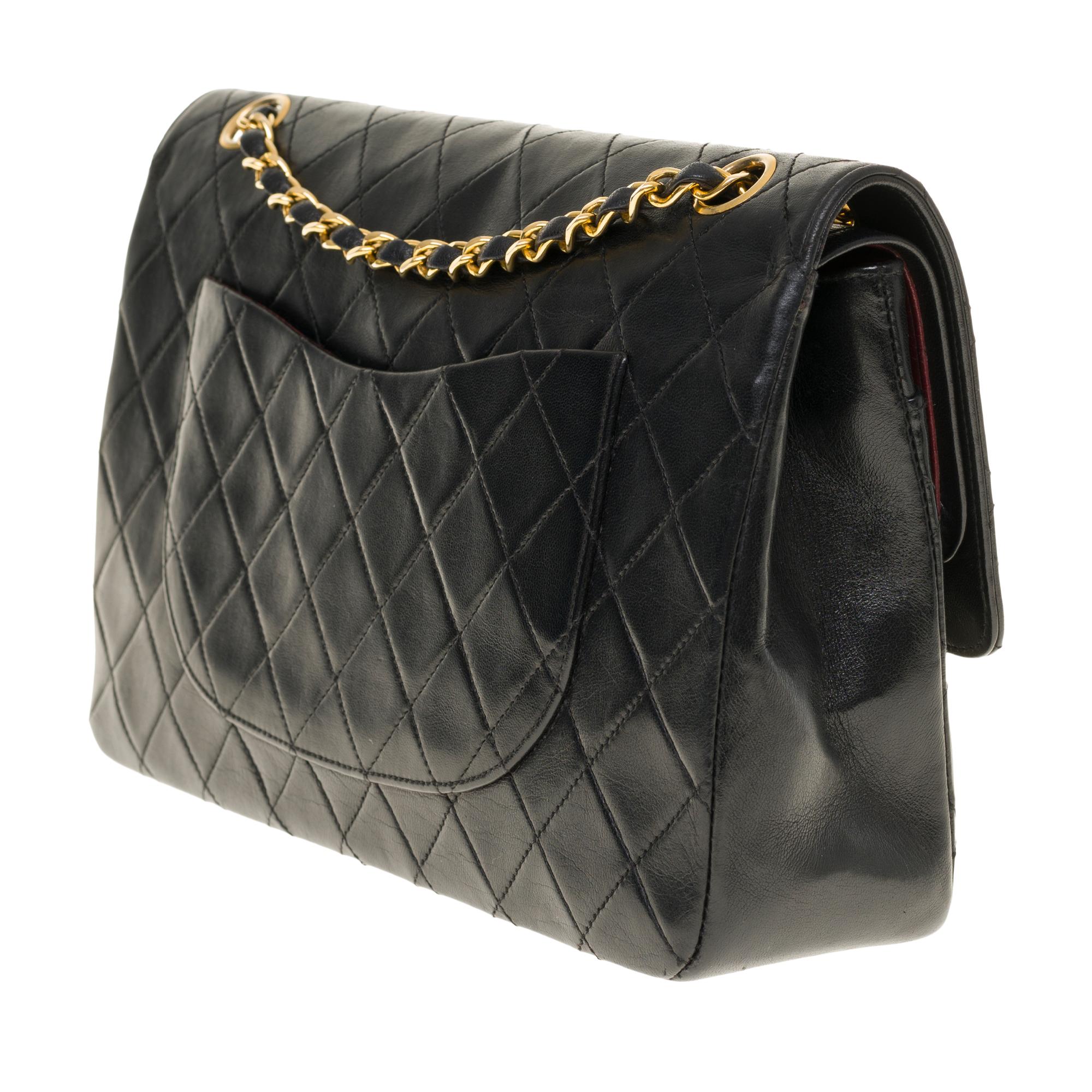Chanel Classic 27cm shoulder bag in black quilted lambskin and gold hardware In Good Condition In Paris, IDF