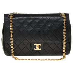 Chanel Classic 27cm shoulder bag in black quilted lambskin and gold hardware