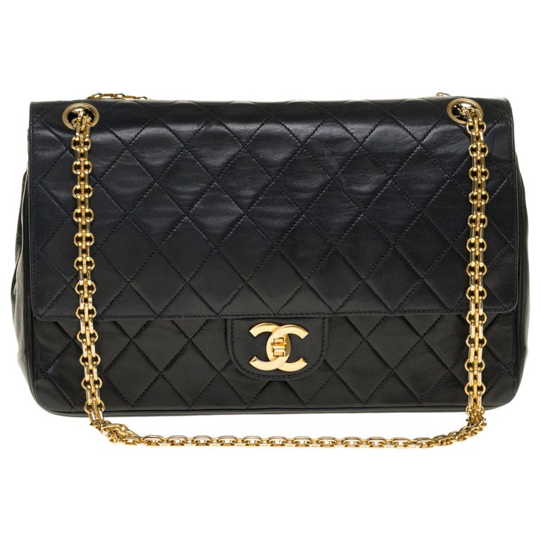 Chanel Classic 27cm shoulder bag in black quilted lambskin and gold ...