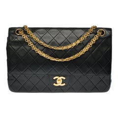 Chanel Classic 27cm shoulder bag in black quilted lambskin and gold hardware