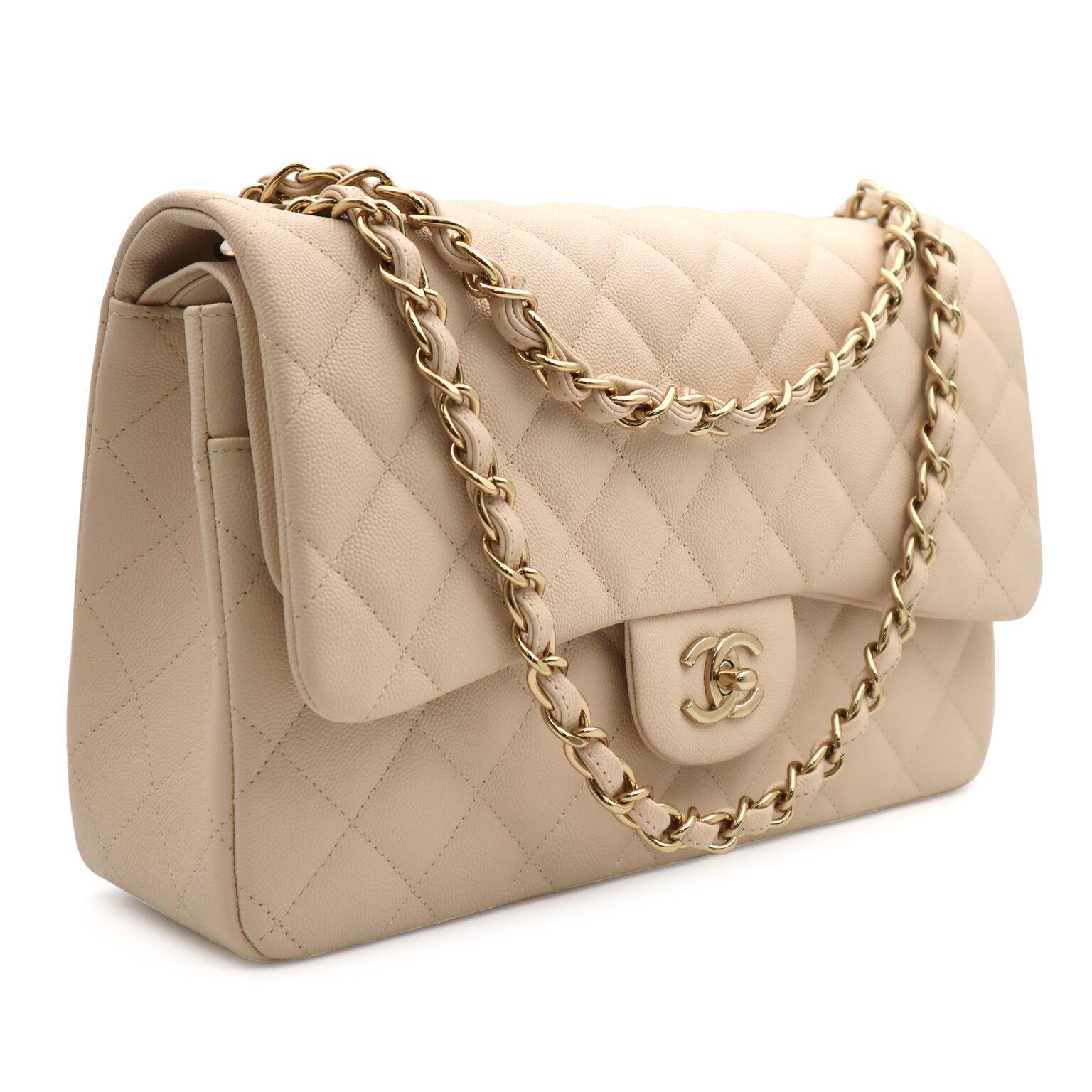 This Chanel Quilted Grained Calfskin Leather Classic Large Double Flap Bag is one of the most popular bags in Chanel's classic collection, which continually increases in value. This bag features quilted, grained calfskin leather, and also features a