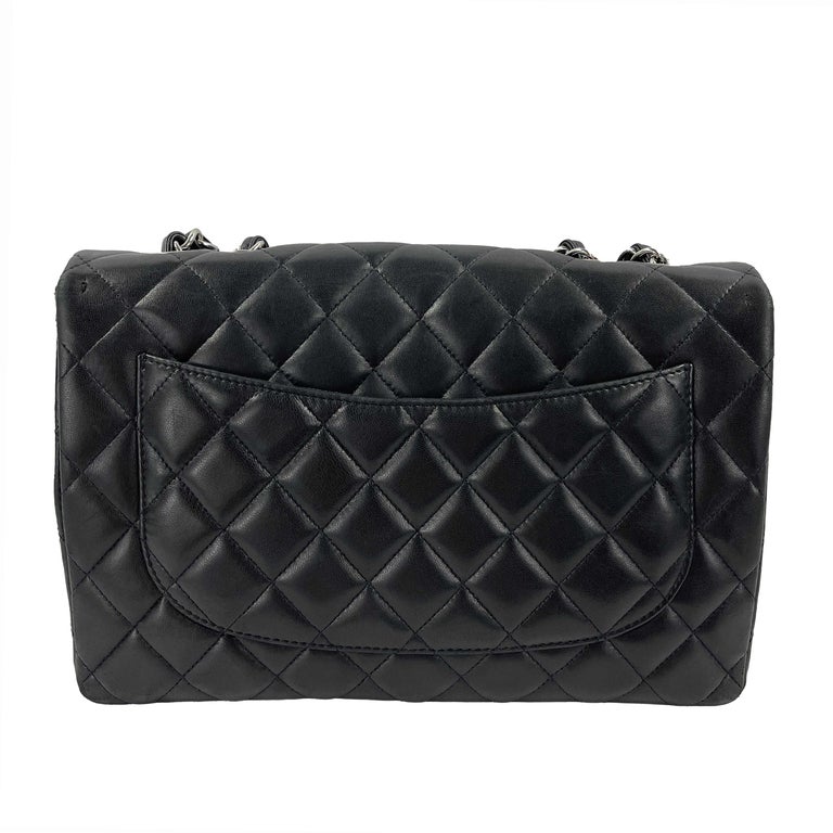  2010-2011 Collection era.
* This handbag is crafted in black lambskin leather with the Chanel signature diamond quilt pattern.
* CC turn lock closure.
* Leather threaded chain link straps can be worn on shoulder or crossbody.
* Patch pocket on