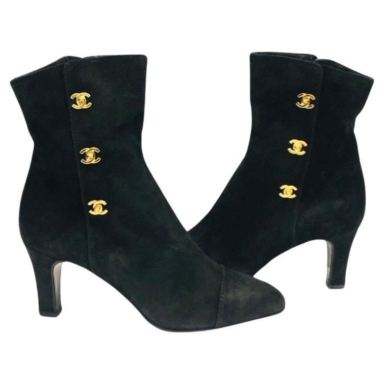 - Chanel black suede ankle boots. A classic collectable item! 

- Gold Hardware CC turn-lock style. 

- Side zip closure.

- Size 37. 

