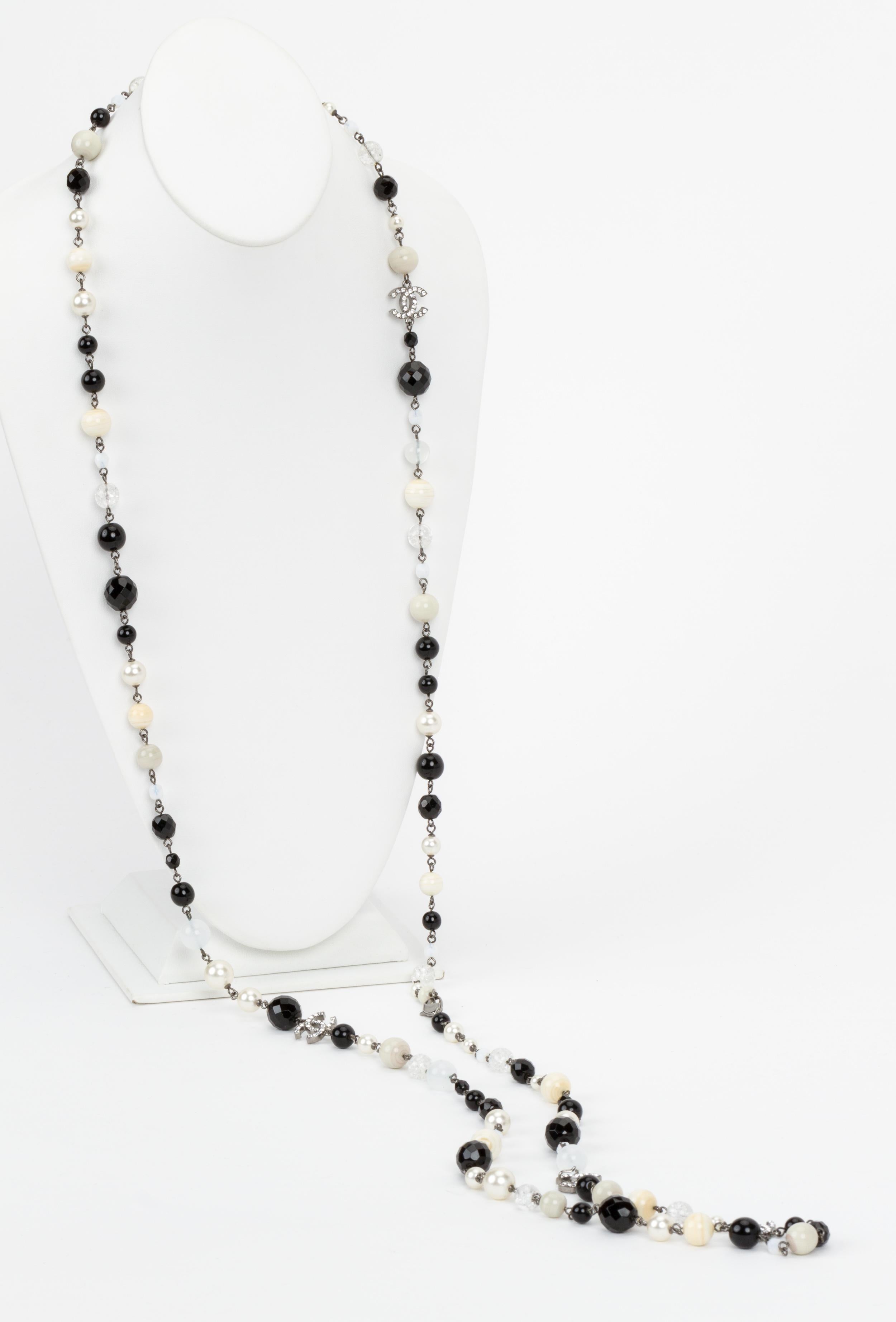 Chanel black and white extra long sautoir necklace. Can be worn up to 4 strands. Autumn 2008 collection. Comes with original box.