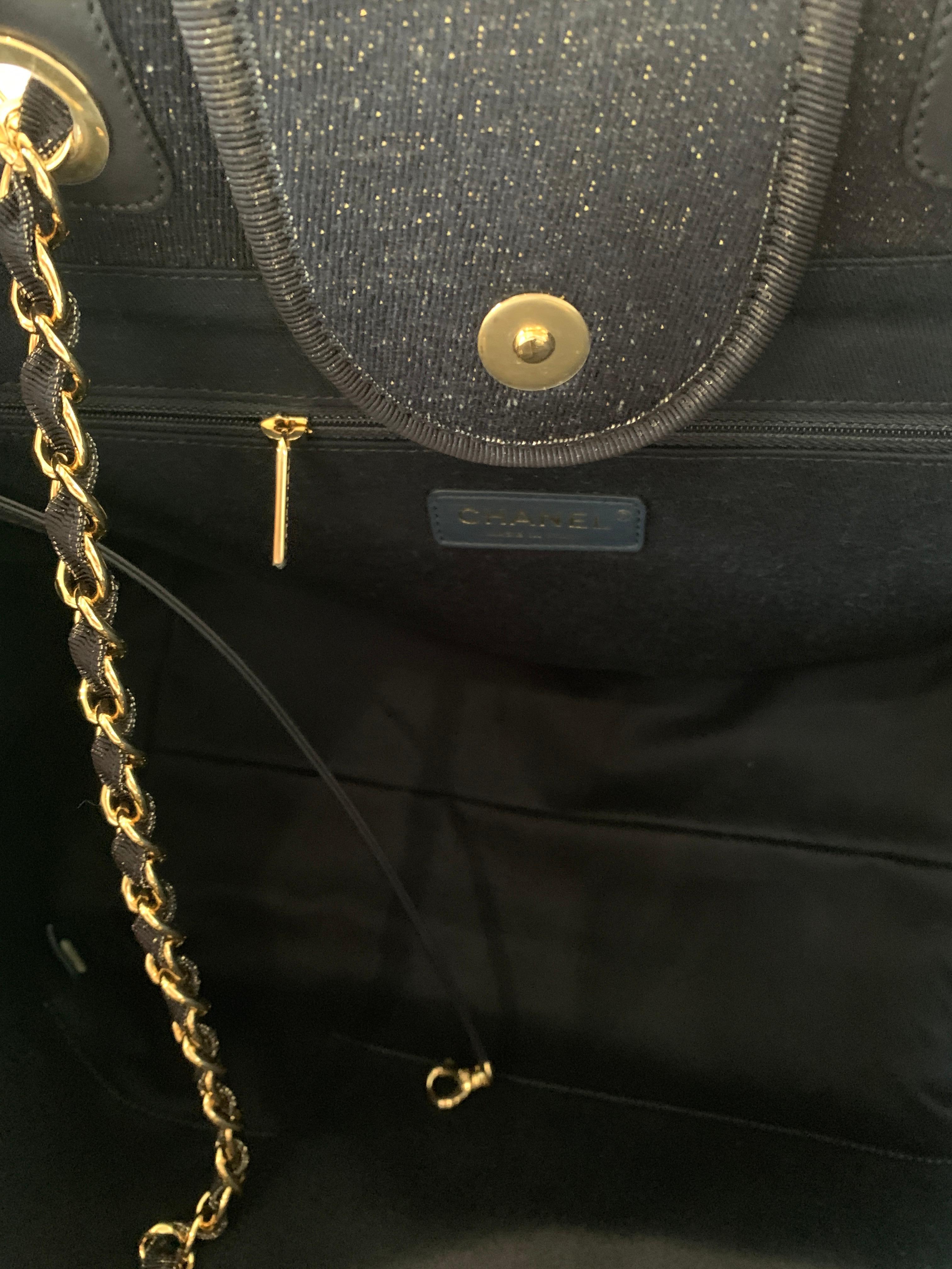 Chanel
The Deauville Tote
Soldout in stores
Navy with Gold Metallic threads running through
This is the Large tote
Purchased by me from the Chanel Boutique. Comes with Dustcover and Box
Beautiful stunning combination

From pre Fall 2019
Mixed Fibers