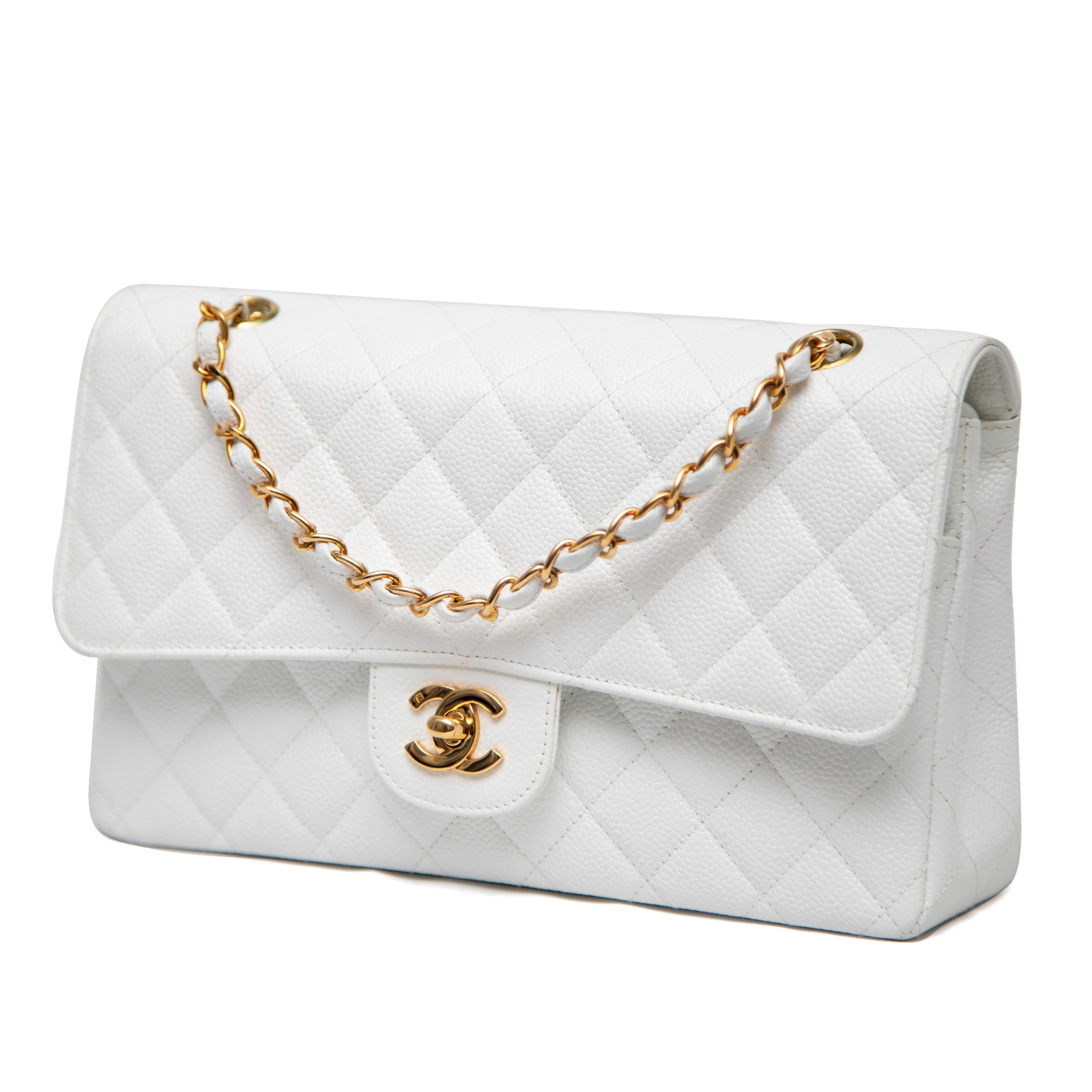 This Chanel Classic Double Flap Bag, in the Jumbo size, is a true vintage treasure from the 1991-1994 era. Crafted from luxurious white caviar leather, renowned for its durability and distinctive pebbled texture, this bag exudes timeless elegance.