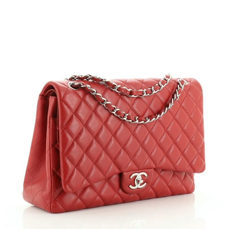 This Chanel Classic Double Flap Bag Quilted Caviar Jumbo, crafted from red quilted caviar leather, features woven-in leather chain strap, exterior back pocket and silver-tone hardware. Its CC turn-lock closure opens to a red leather interior with