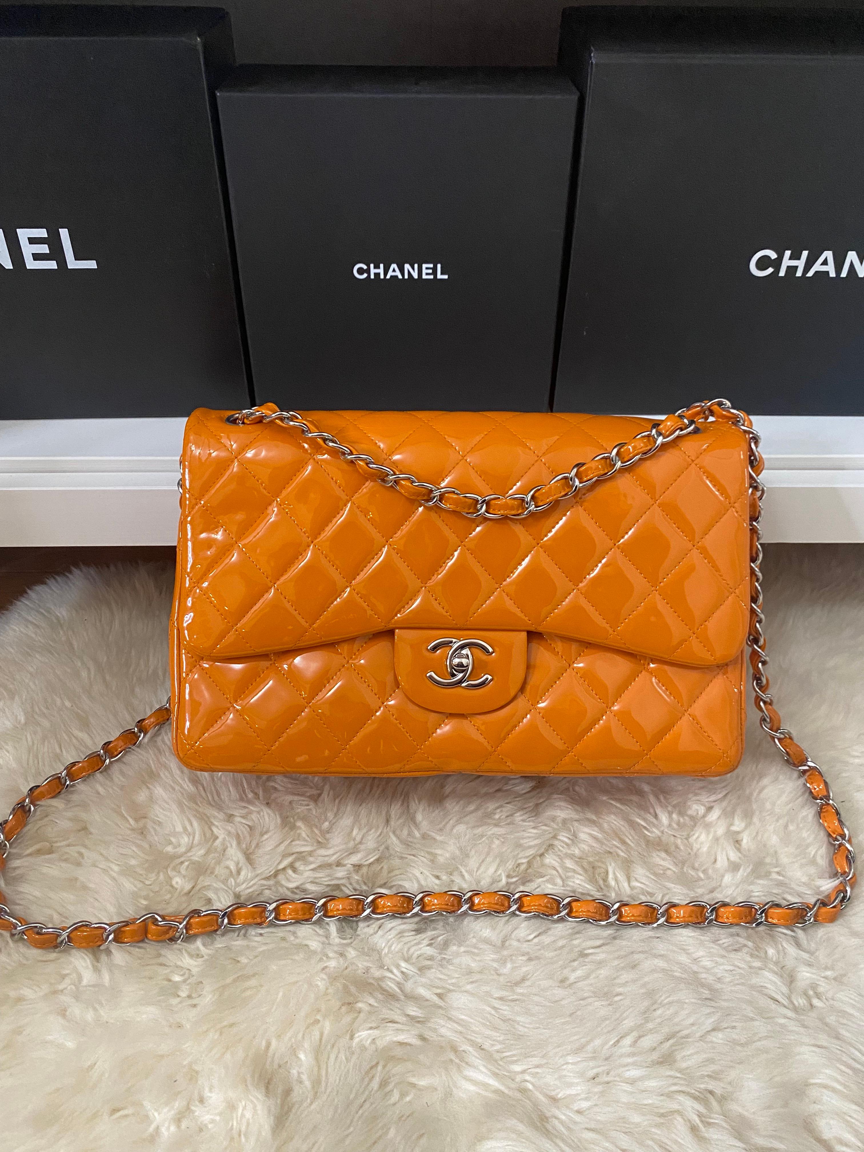 Chanel Classic Double Flap Jumbo Patent Orange

Exterior Color: Orange
Interior Color: Orange
Exterior Material: Patent Leather
Interior Material: Leather
Hardware Color: Silver
Accessories: No Accessories
Serial: 20 series
SIZE AND FIT: 12