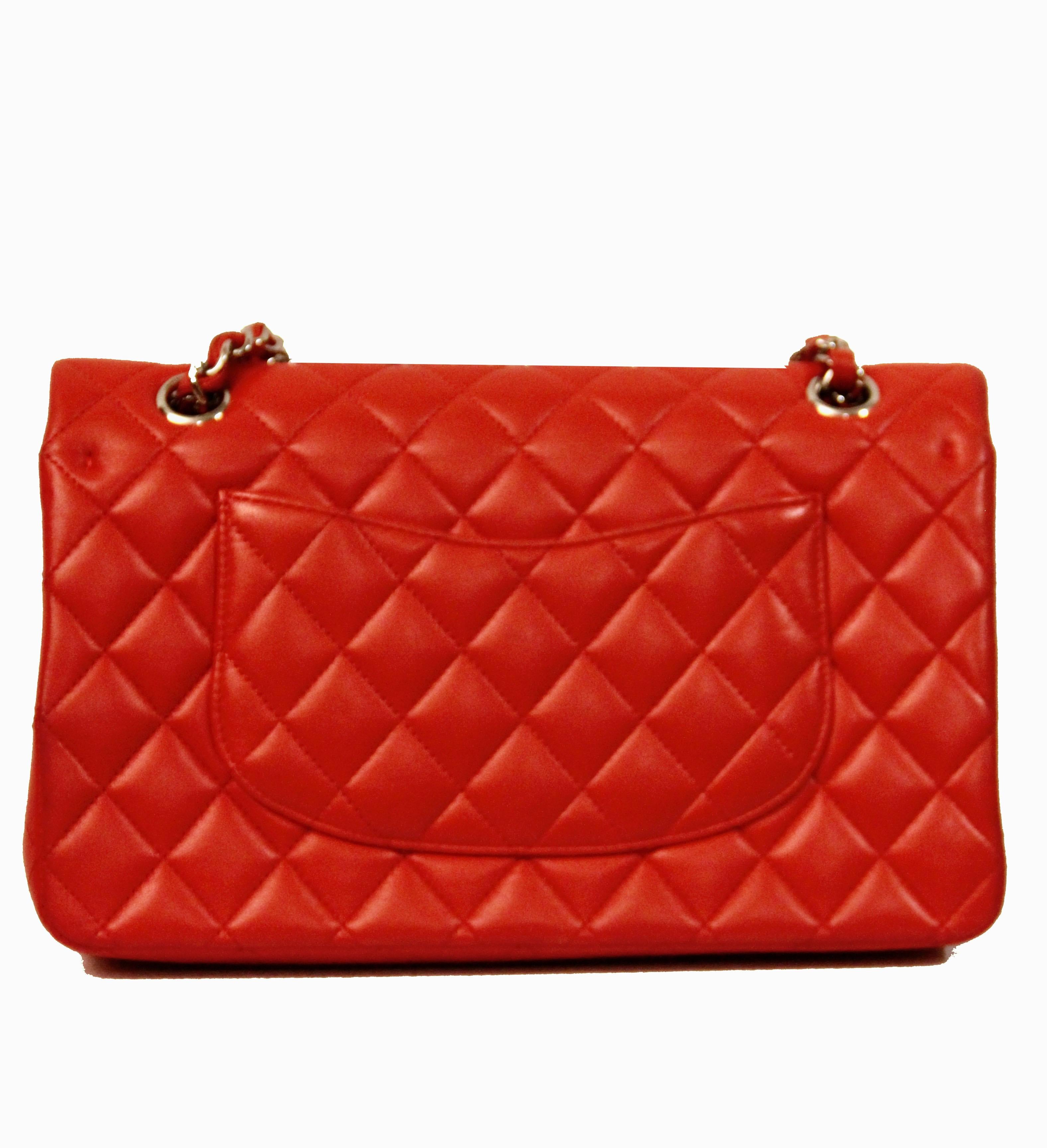 This pre-owned Classic Handbag from Chanel is made of a Limited Edition color - red/orange - quilted lambskin and silver-tone metal finish.

Year: 2014
Leather: Lambskin
Color: Red/Orange
Hardware: Silver-Tone Metal finish
Dimensions: 25.5 x 16.5 x