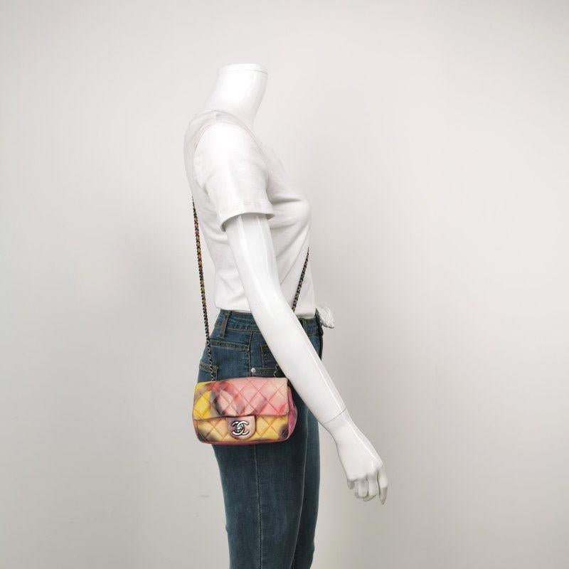 Chanel Classic Flap 2014-2015 Multicolor Flower Power Lambskin Leather Mini Crossbody Bag
These are professional photos of the actual bag.
  CONDITION: GOOD
  This previously owned and used item is in good condition with moderate signs of use.
