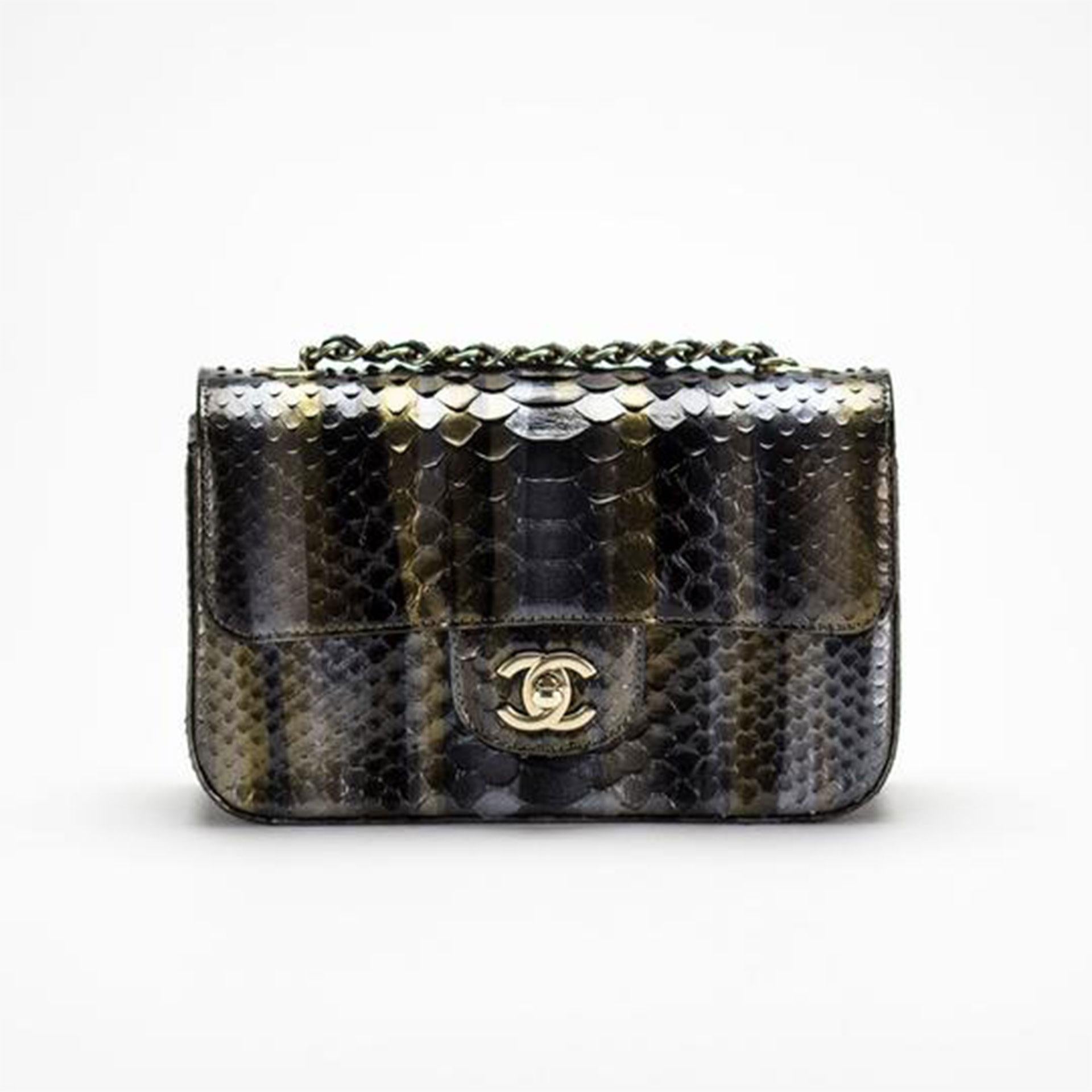 Chanel 2014 Dallas Métiers d'Art Ombré Python Rare Classic Flap

Gold hardware
Classic back pocket
Classic CC turnlock clasp
Interior center zippered pocket
Grey interior lambskin lining
Additional interior pocket
Interwoven chain
Strap Drop 21”
9”