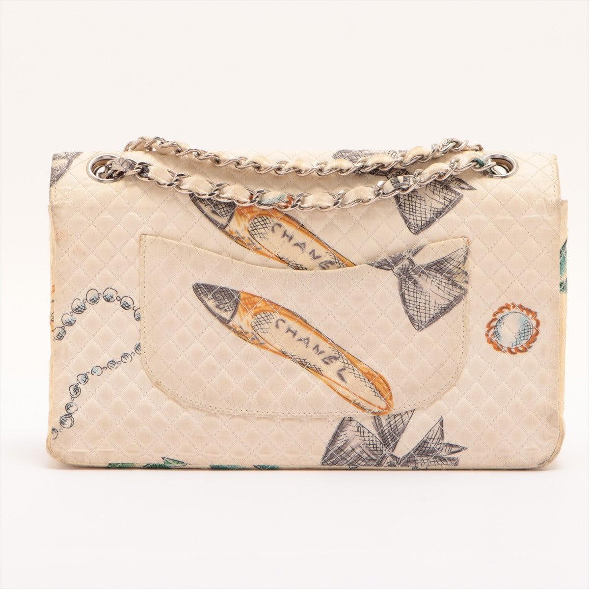 Chanel Classic flap bag features diamond quilted canvas in beige with drawings of some Chanel icons (CC logo, Camelia flowers, bows, pearl necklaces, quilted bags & shoes), silver-tone hardware, CC turn-lock at front, interlaced chain with canvas