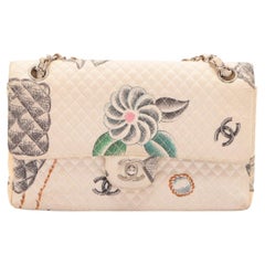 Chanel Classic flap bag features diamond quilted canvas in beige with drawings