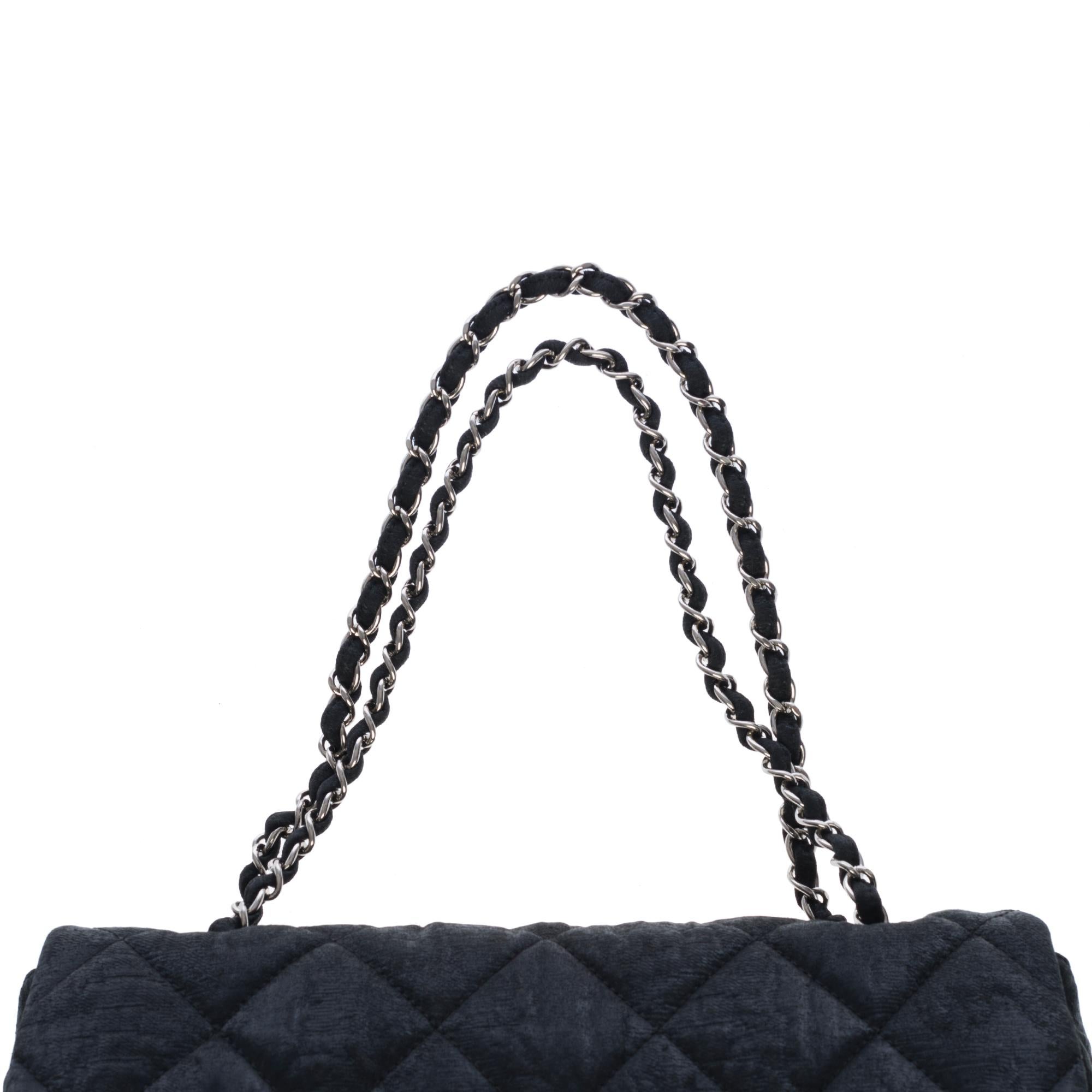 Women's Chanel Classic Flap bag shoulder bag in black quilted fabric and silver hardware