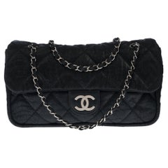 Chanel Classic Flap bag shoulder bag in black quilted fabric and silver hardware