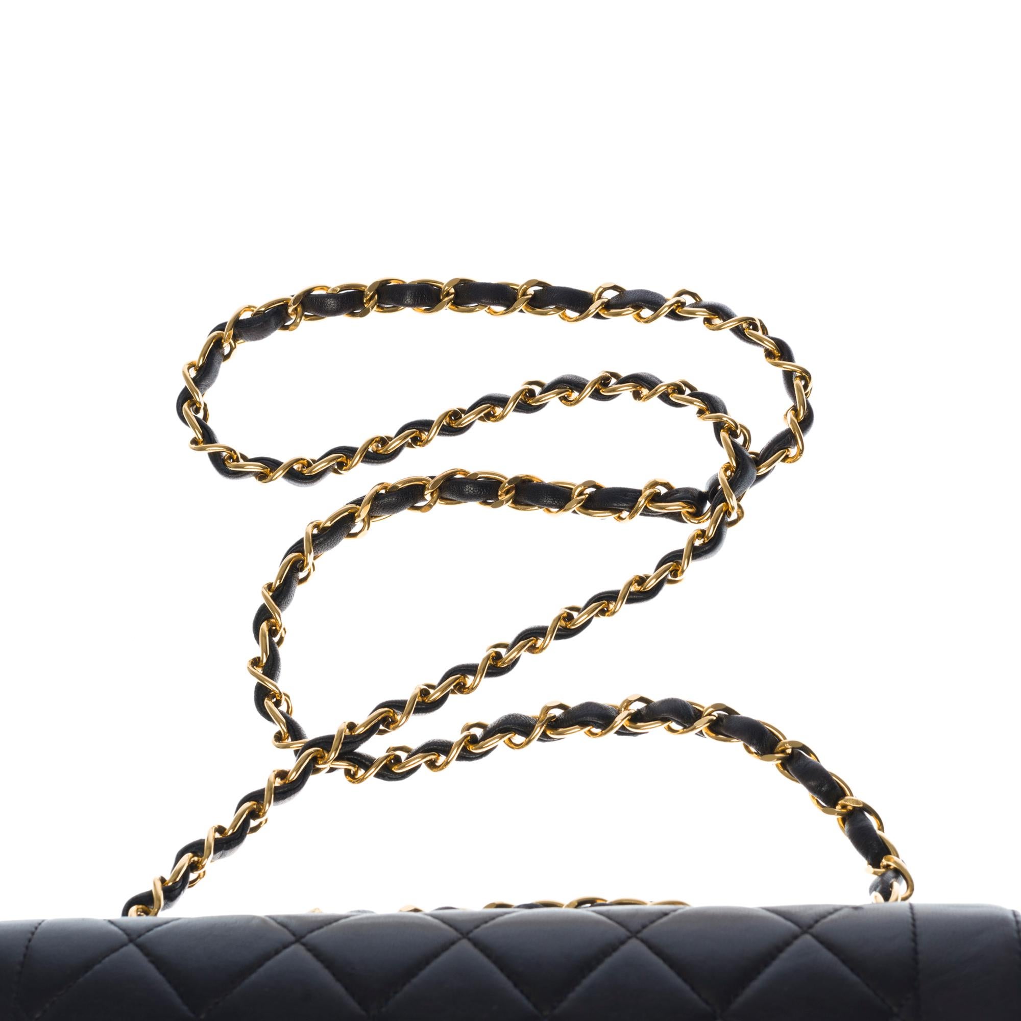 Women's Chanel Classic Flap bag shoulder bag in black quilted lambskin and gold hardware