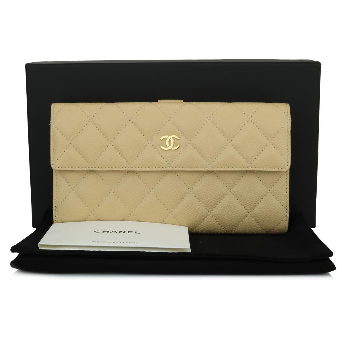 Authentic CHANEL Classic Flap Bifold Wallet Beige Caviar with Gold Hardware 2012.

This stunning flap wallet is in pristine condition, the wallet still holds its original shape, and the hardware is still very shiny.

Exterior Condition: Pristine