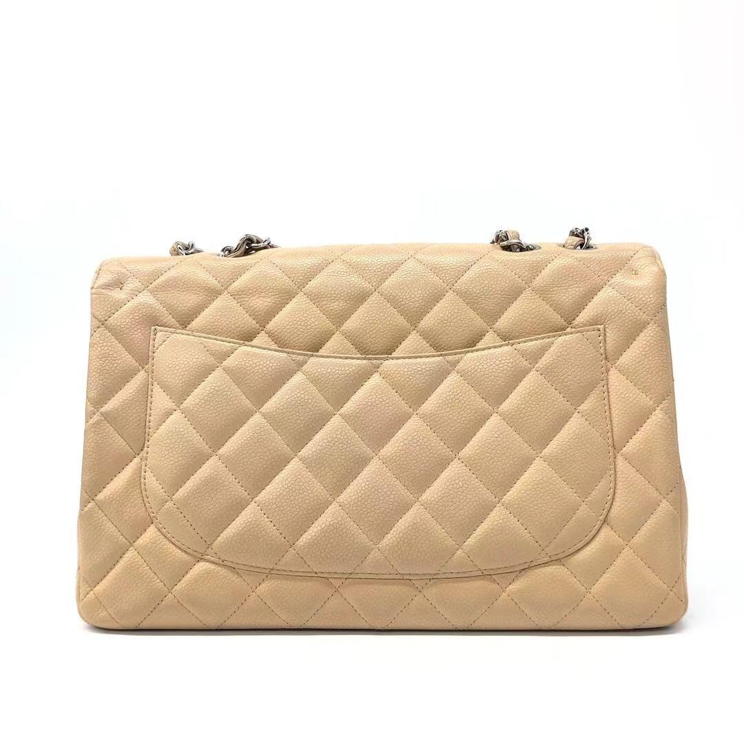 Chanel Classic Flap Jumbo 2009 Beige Caviar Leather Single Flap Silver Hardware
These are professional photos of the actual bag.
  Embrace luxury with this timeless Chanel Classic Jumbo/Large Flap bag crafted in a scratch-resistant Caviar leather