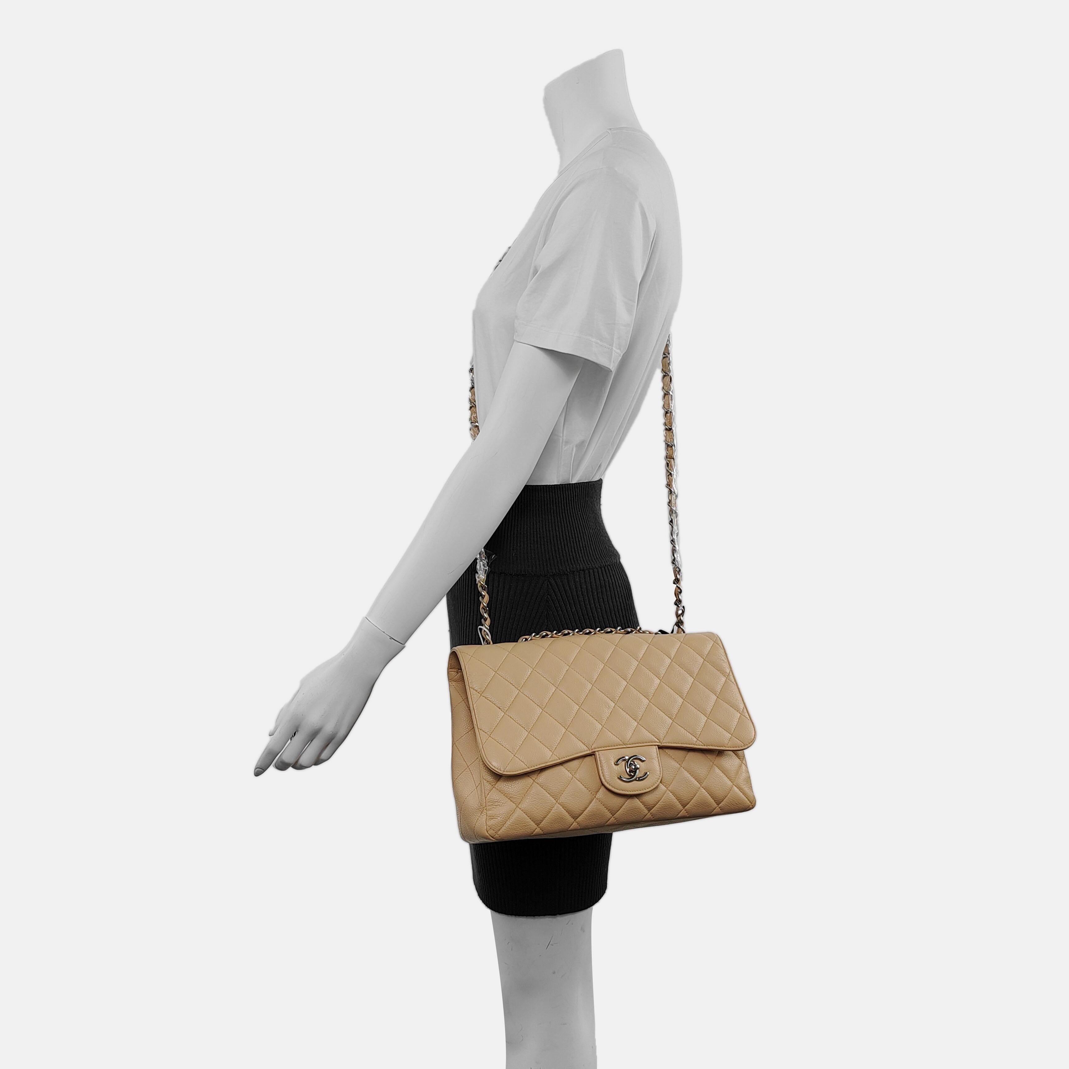 Chanel Classic Flap Jumbo 2009 Beige Caviar Leather Single Flap Silver Hardware
These are professional photos of the actual bag.
  Embrace luxury with this timeless Chanel Classic Jumbo/Large Flap bag crafted in a scratch-resistant Caviar leather