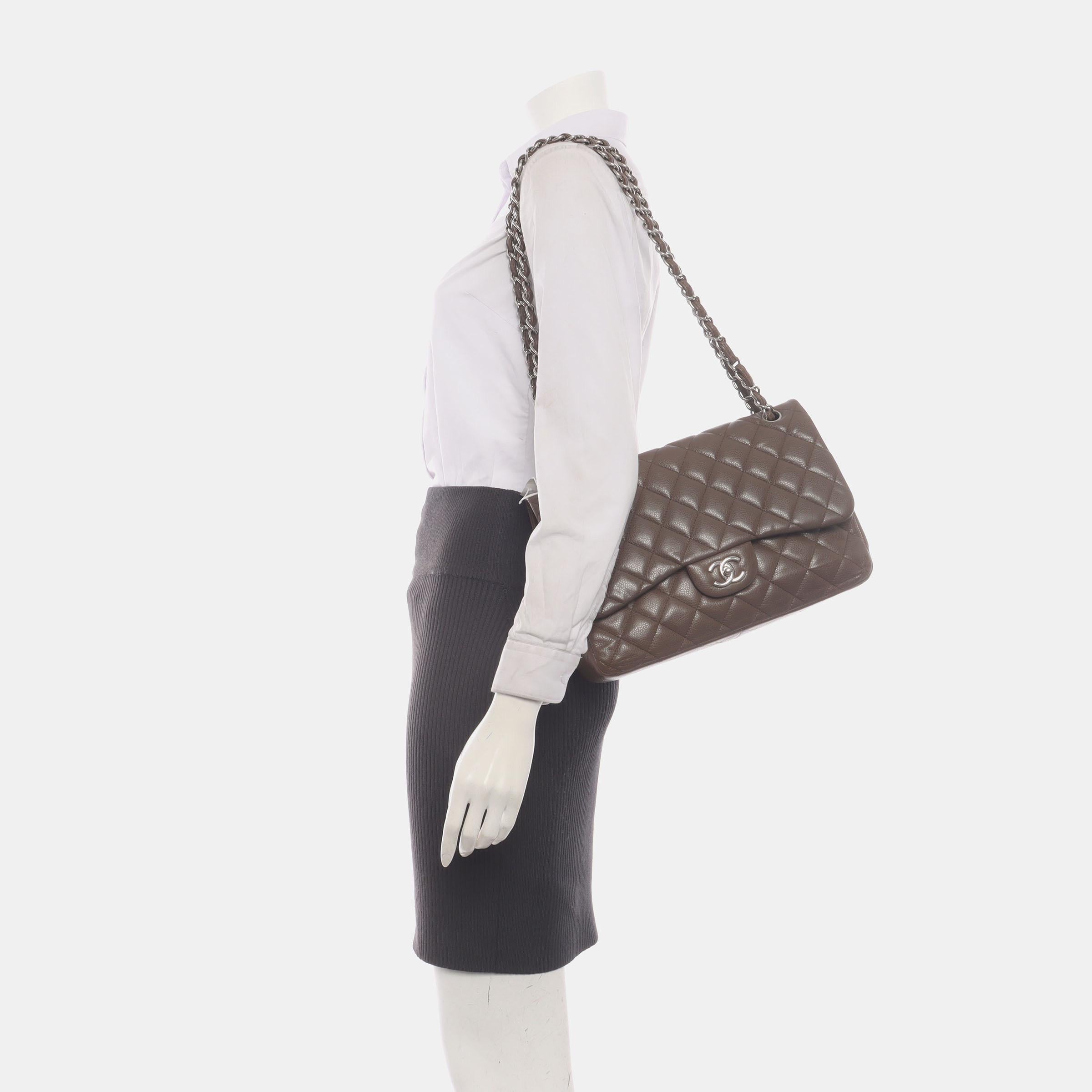 Embrace luxury with this timeless Chanel Classic Jumbo/Large Flap bag crafted in a scratch-resistant Caviar leather and finished with gleaming silver hardware.

CONDITION: EXCELLENT

Light creases on the bottom. Rubbing around the corners, and