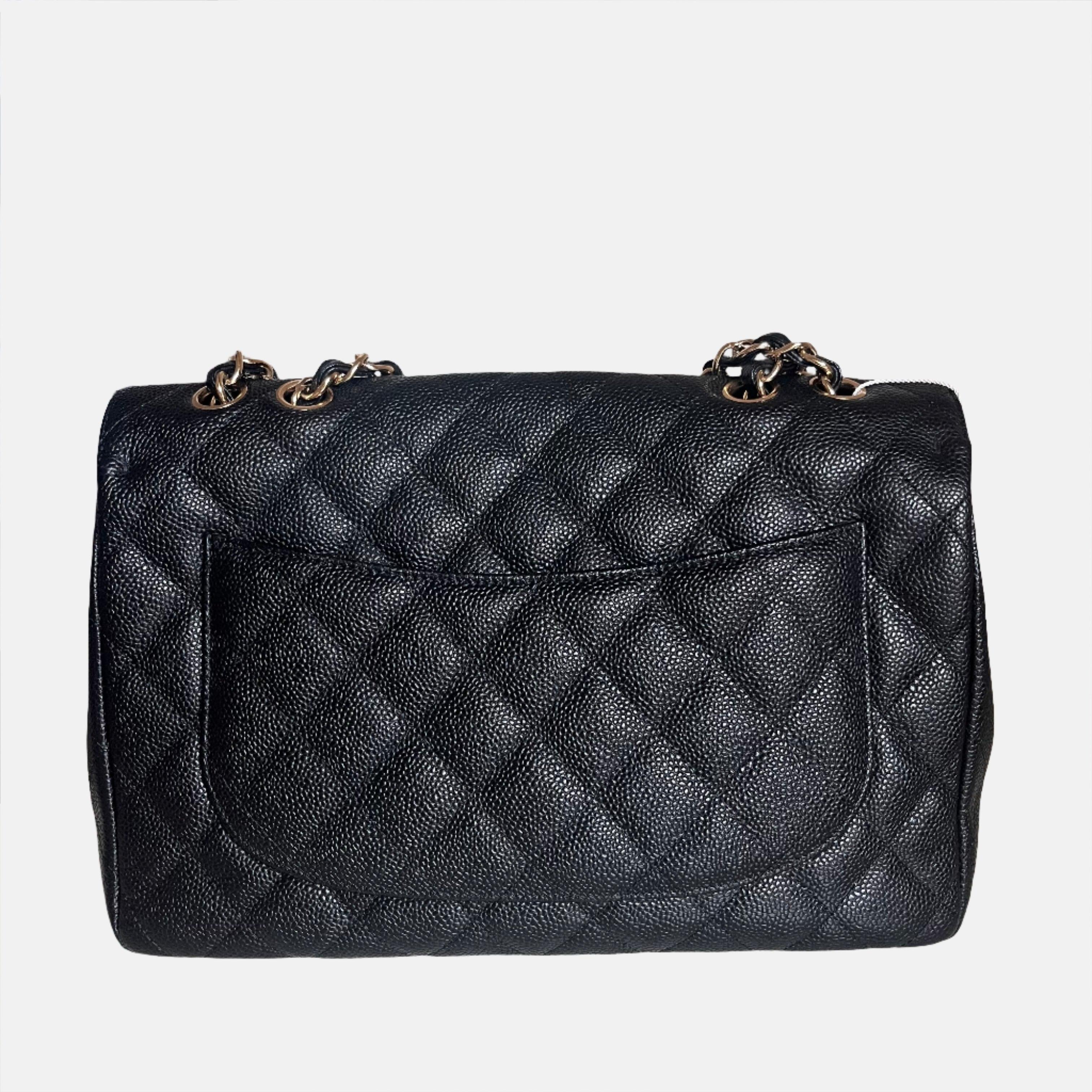 Chanel Classic Flap 2009 Jumbo Black Caviar Leather Single Flap with Gold Hardware

Embrace luxury with this timeless Chanel Classic Jumbo/Large Flap bag crafted in a scratch-resistant Caviar black leather and finished with gleaming gold hardware.