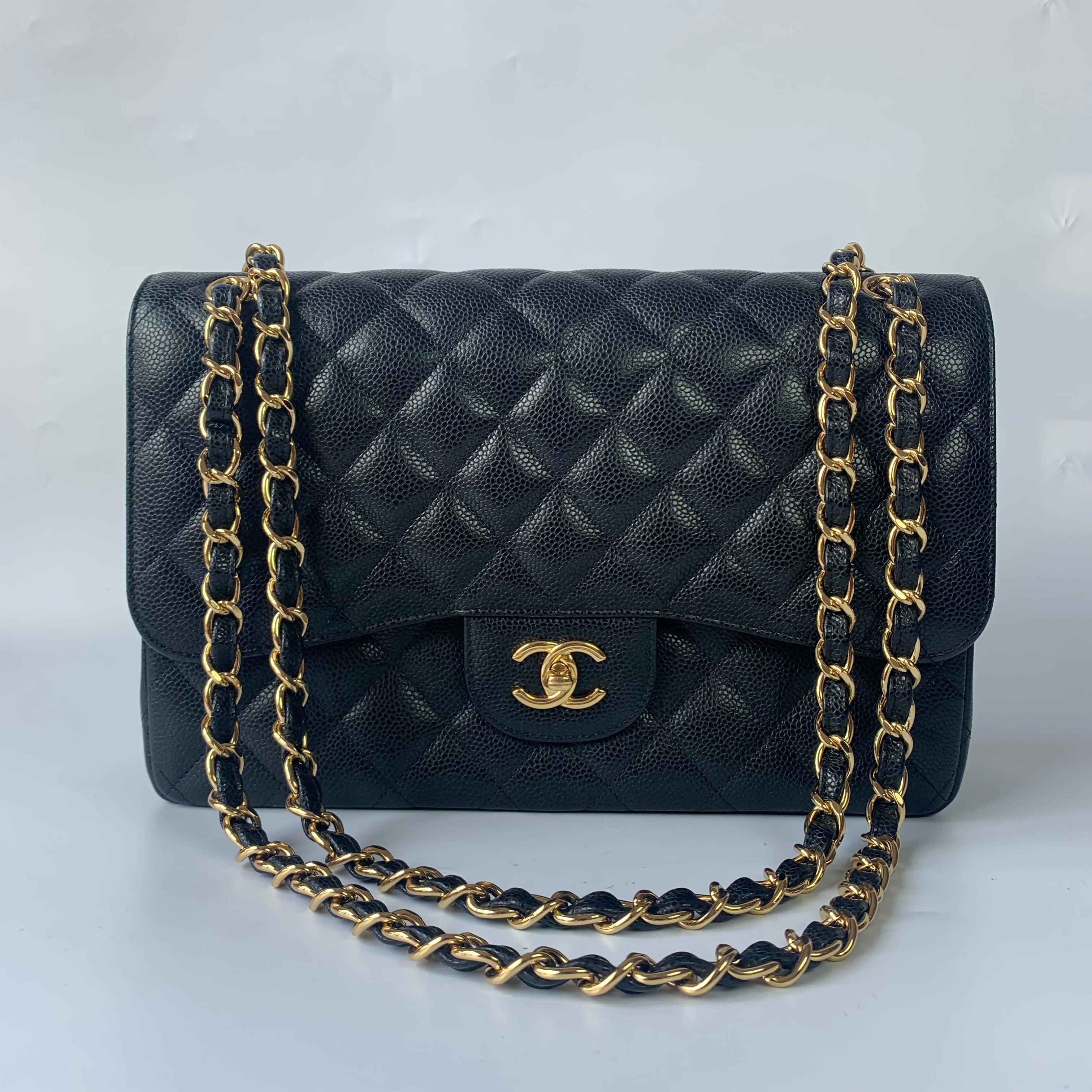 Chanel Classic Flap Jumbo Black Caviar Leather Double Flap with Gold Hardware, 2015-2016
These are professional photos of the actual bag.
  Embrace luxury with this timeless Chanel Classic Jumbo/Large Flap bag crafted in a scratch-resistant Caviar