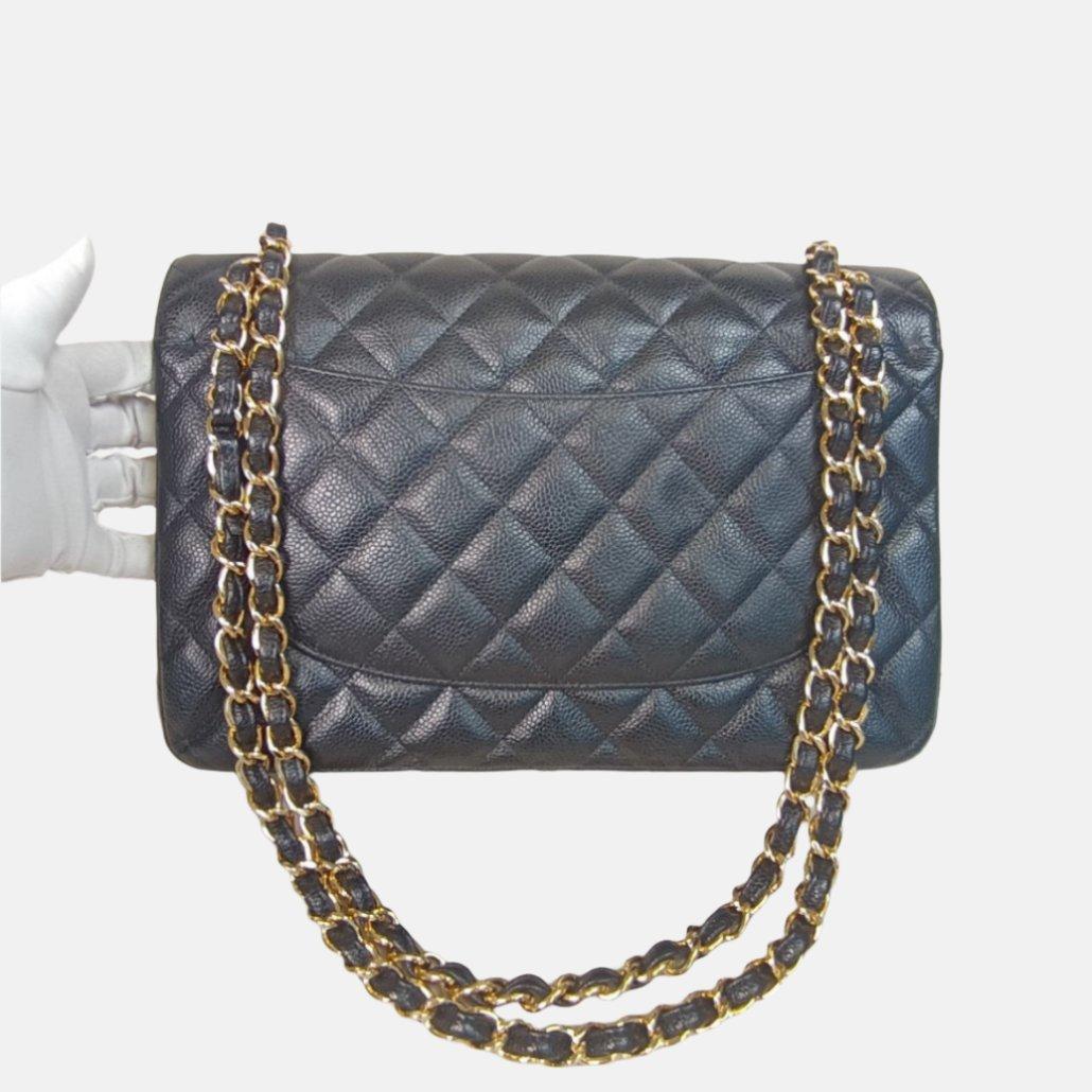 Chanel Classic Flap Jumbo Black Caviar Leather Double Flap with Gold Hardware, 2012
 These are professional photos of the actual bag offered by Luxbags.
 Embrace luxury with this timeless Chanel Classic Jumbo/Large Flap bag crafted in a