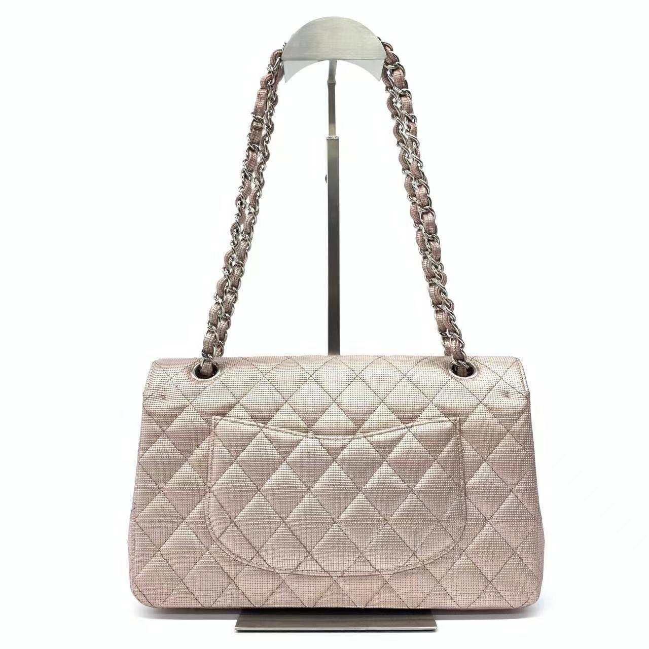 Chanel Classic Flap Medium 2016 Pink Metallic Pixel Effect Calfskin Leather

  CONDITION: VERY GOOD
  This previously owned and used item is in good condition with some signs of use. This may include fading of material or plating and scratches,