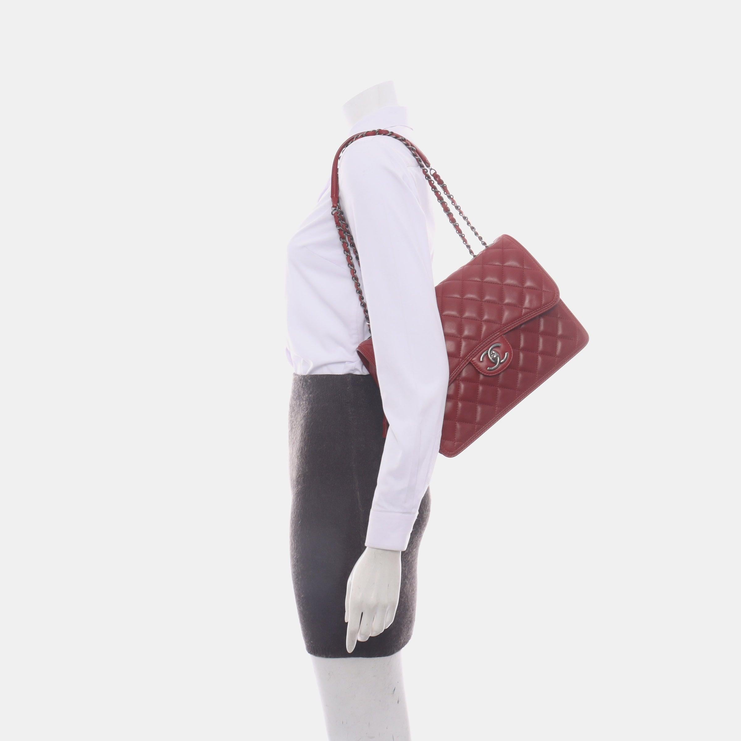 Chanel Classic Flap Jumbo Large Red Calfskin Leather, 2013-2014

  CONDITION: VERY GOOD
  Crease lines on the leather, scratches to the hardware, cracks on the resin along the edges, light stains. Rubbing around the corners. Color may have been