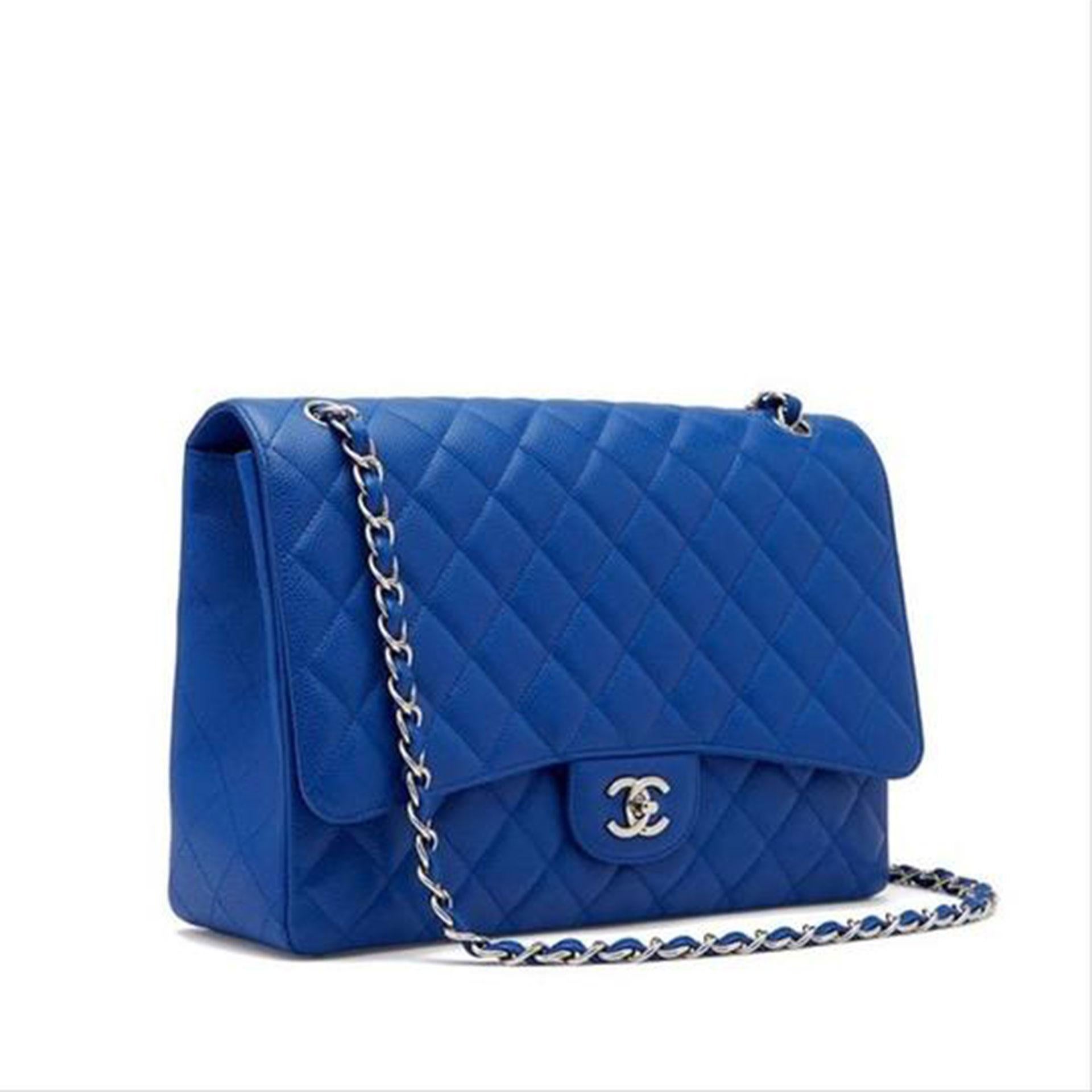 Chanel Rare Limited Edition Caviar Blue Roi Maxi Classic Flap Bag

Year: 2009 {VINTAGE 13 Years}
Silver hardware
Diamond quilted caviar leather
Classic interwoven chain strip
CC turn-lock closure
Strap drop: 9