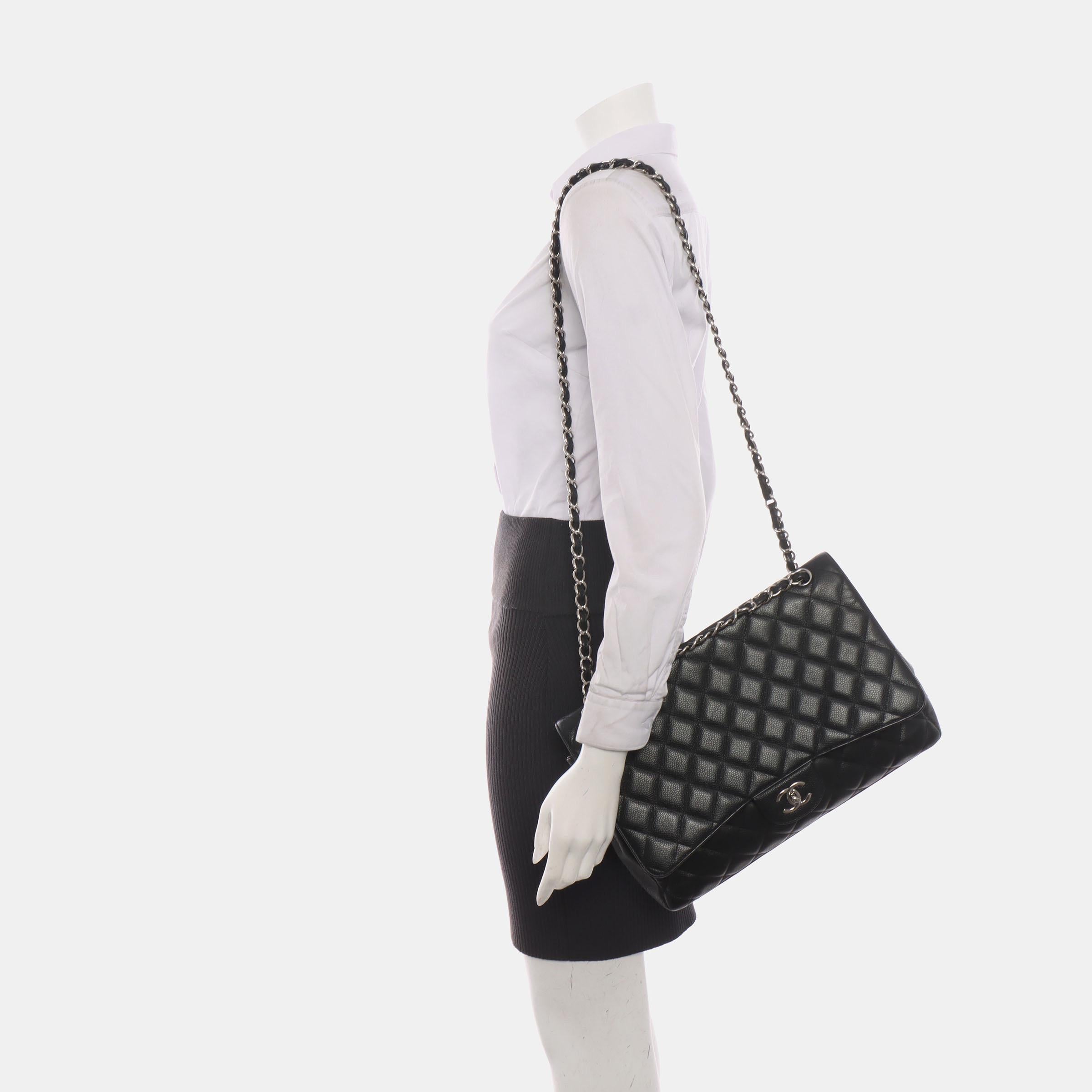 Embrace luxury with this timeless Chanel Classic Jumbo/Large Flap bag crafted in a scratch-resistant Caviar black leather and finished with gleaming gold hardware. 



CONDITION: VERY GOOD 

Light creases near the bottom and on the back near the