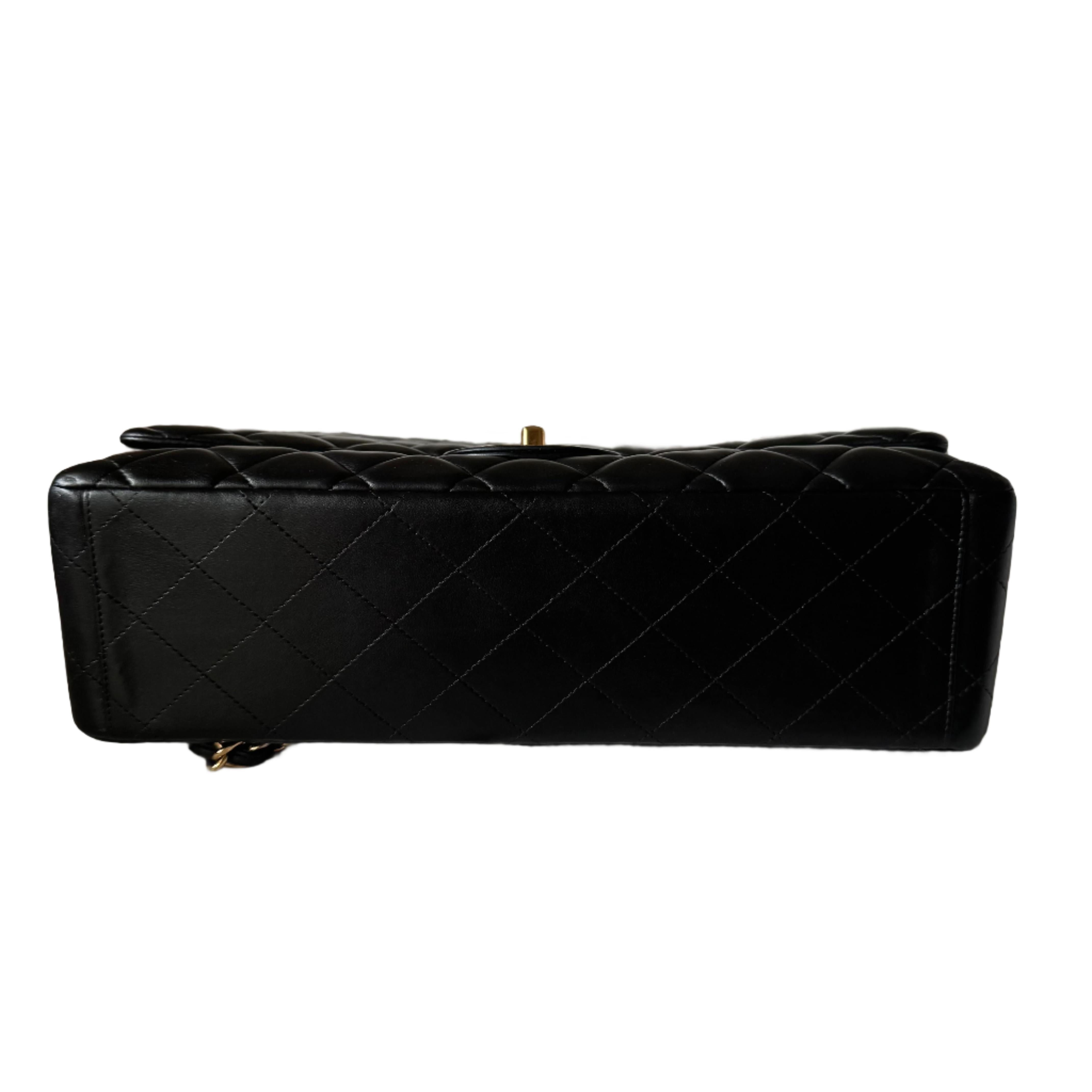 Embrace luxury with this timeless Chanel Classic Maxi Flap bag crafted in luxurious lambskin leather and finished with gleaming gold hardware. 


CONDITION: VERY GOOD 

Light creases near the bottom and on the back near the top. Rubbing on the