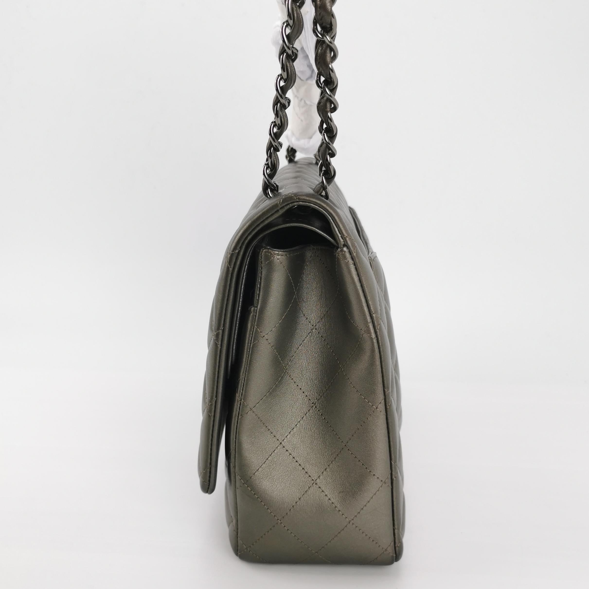 Chanel Classic Flap Maxi Metallic Lambskin Leather Double Flap Sliver Hardware 2013-14
These are professional photos of the actual bag offered by Luxbags.
Embrace luxury with this timeless Chanel Classic Maxi Flap bag crafted in a scratch-resistant