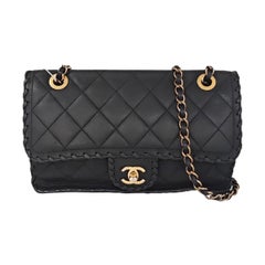 Chanel Classic Flap Mediana Piel de becerro envejecida negra Borde trenzado Oro HW