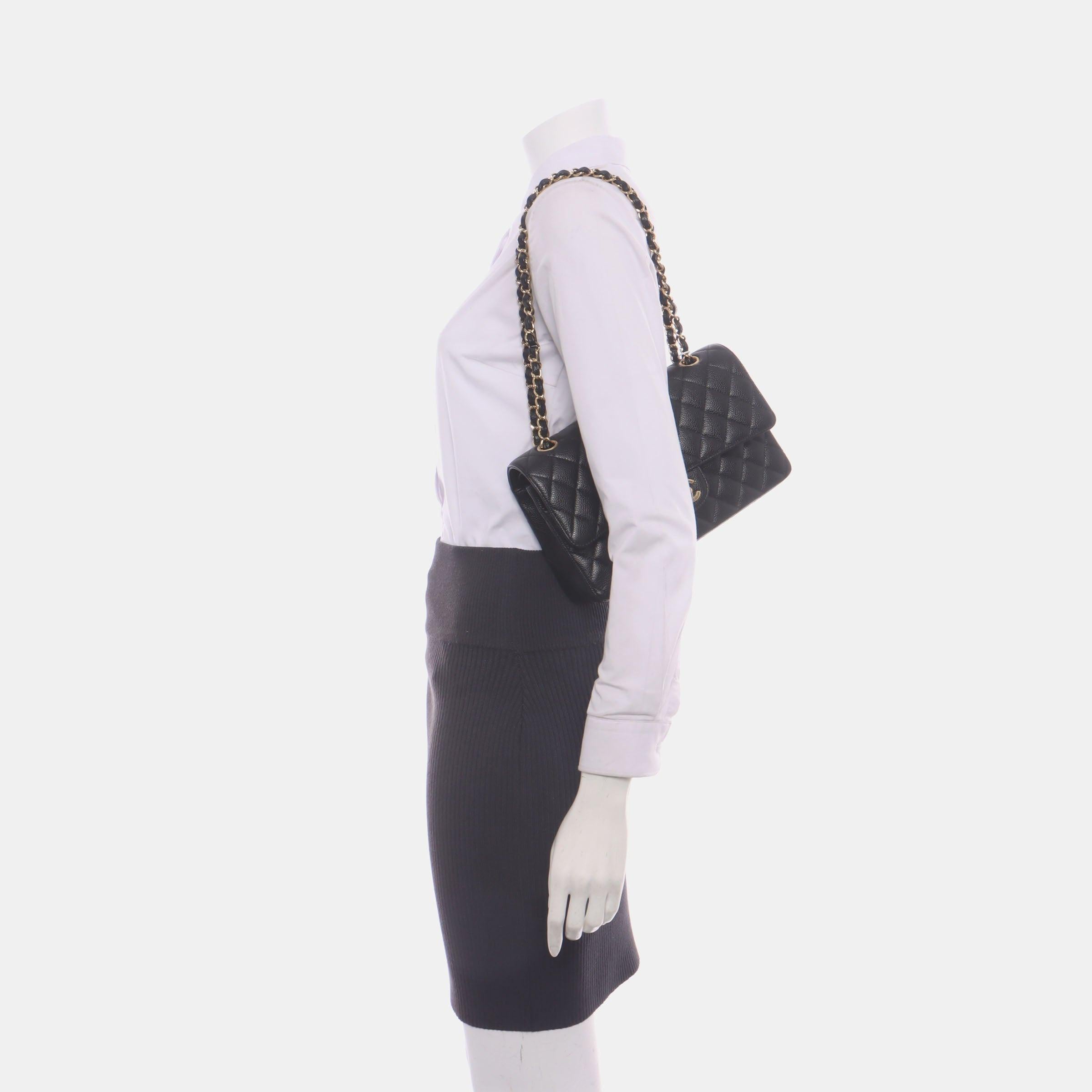 Chanel Classic Flap Medium Black Caviar Leather with Gold-tone Hardware, 2018
These are professional photos of the actual bag.
CONDITION: EXCELLENT
This authentic Chanel bag is in rare excellent original condition. Light scratches around hardware,